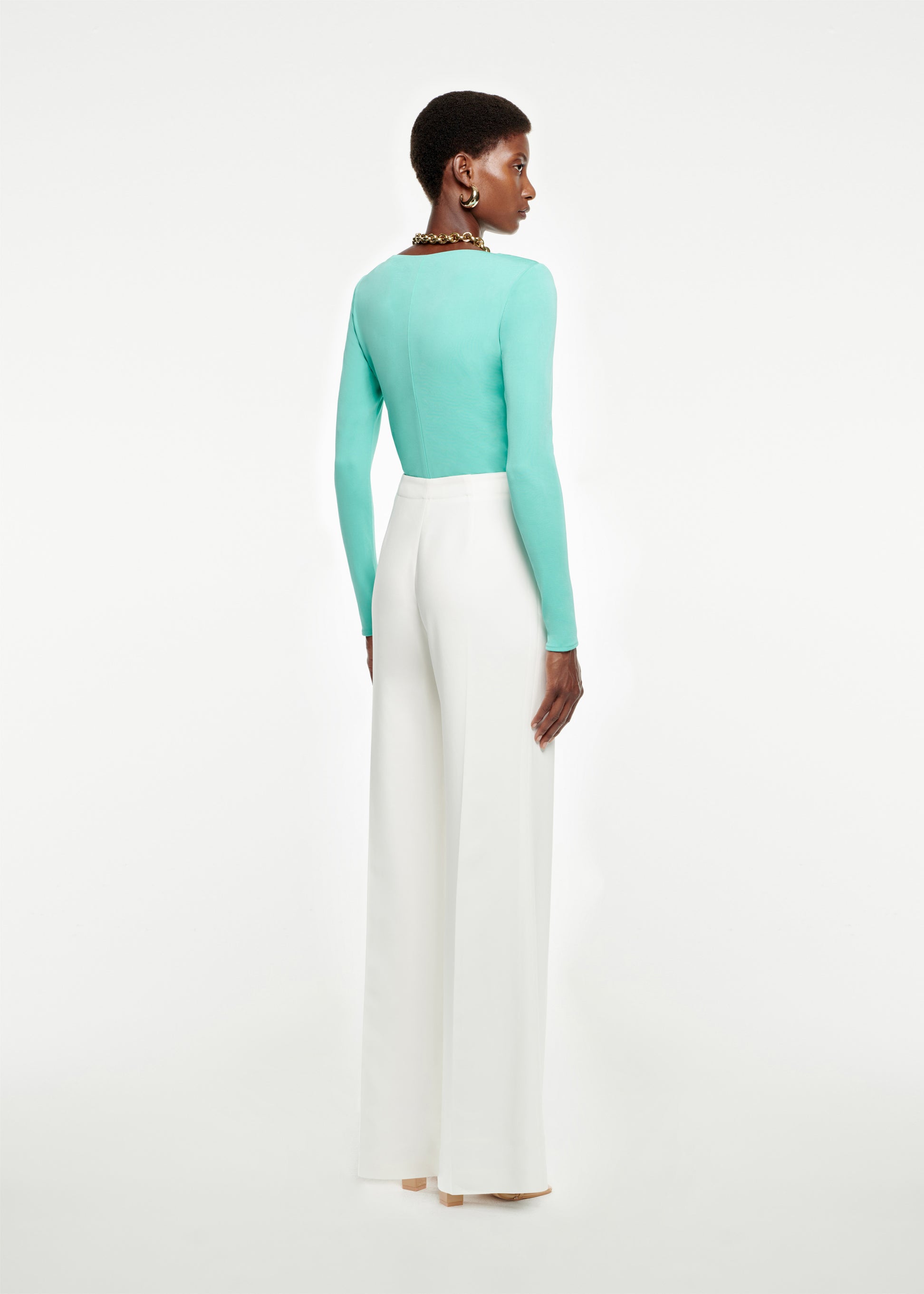 The back of a woman wearing the Wide Leg Stretch-Cady Trouser in White