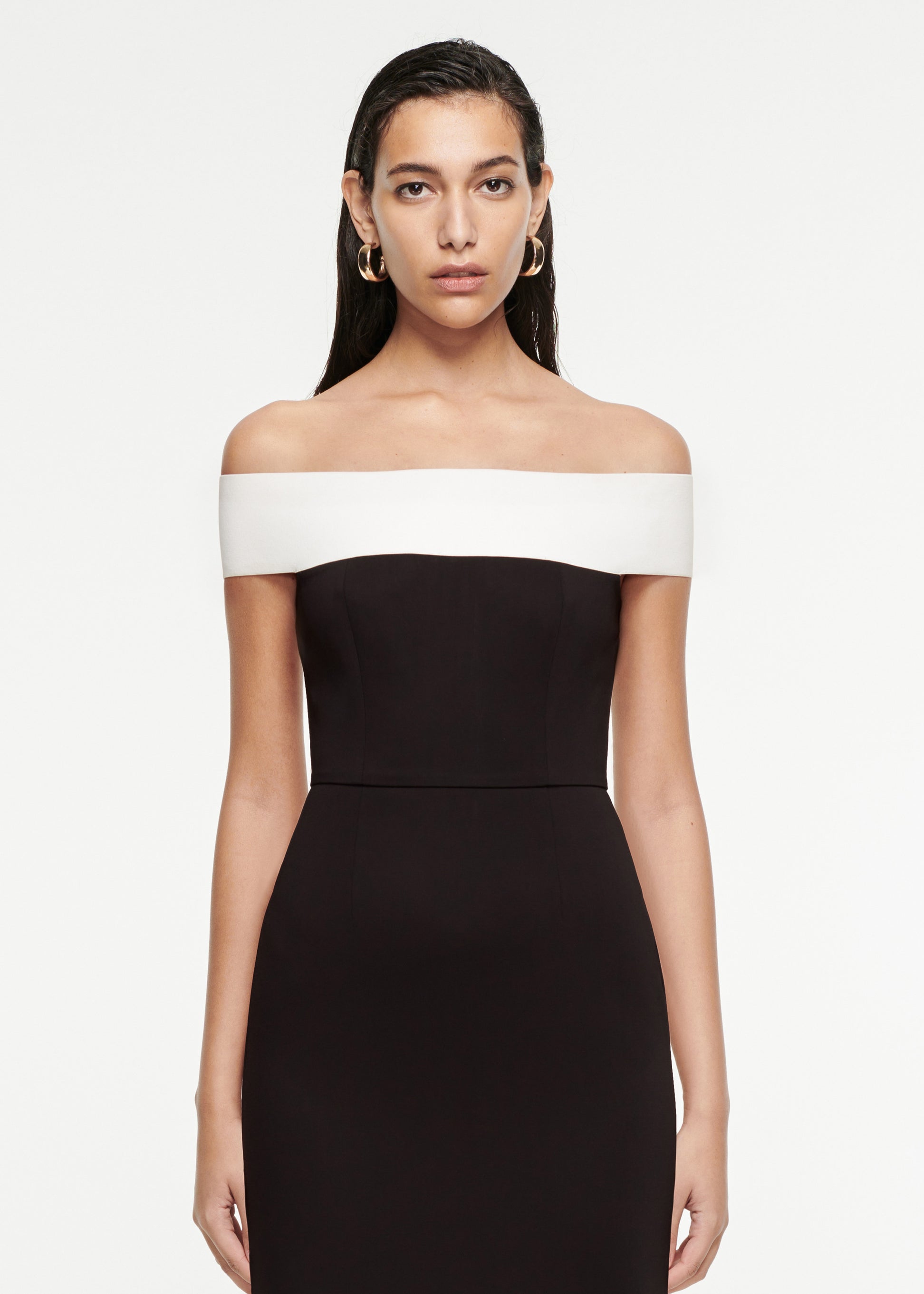 Close up of a model wearing the Off-The-Shoulder Stretch-Cady Gown in Black