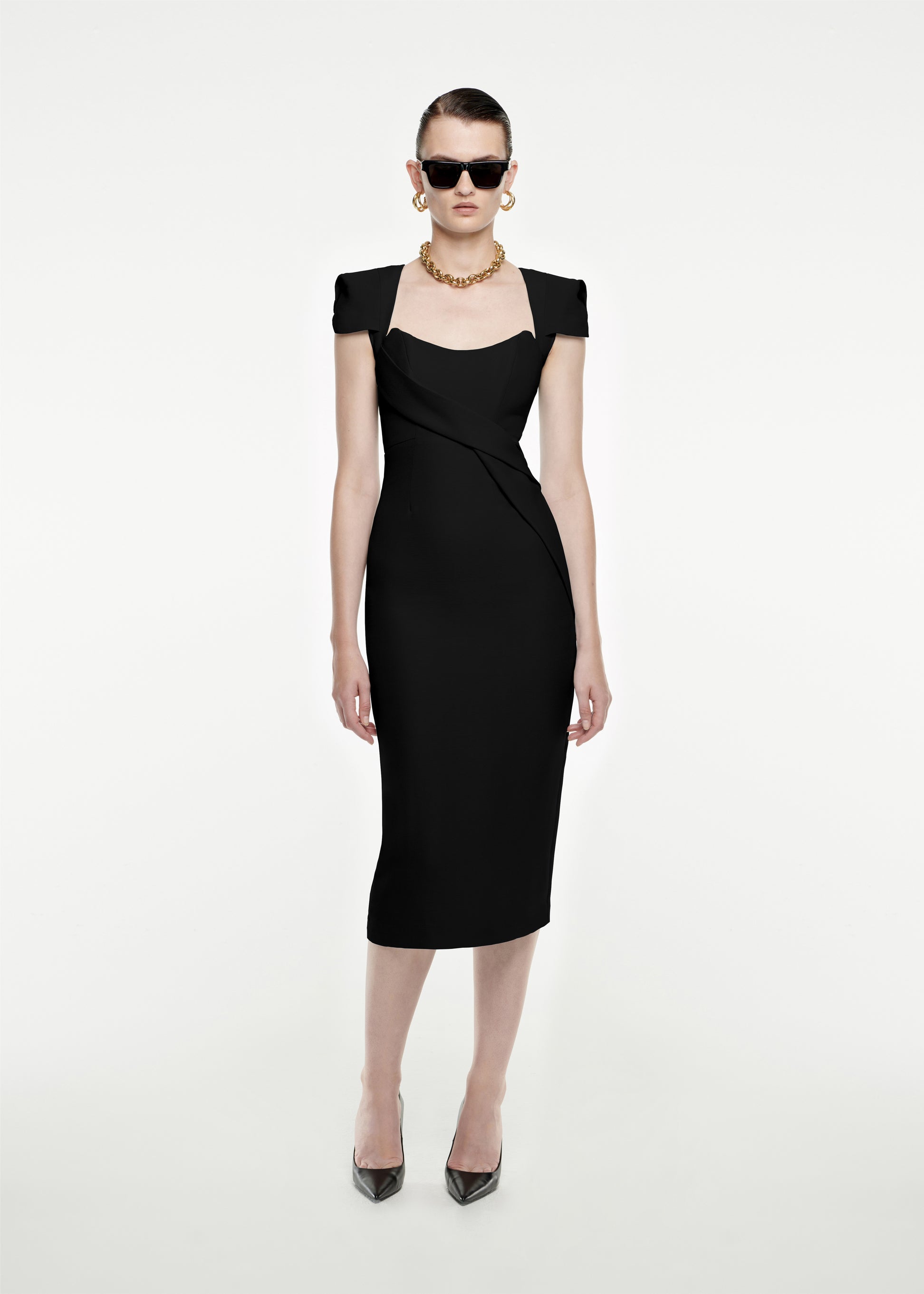 Woman wearing the Cap Sleeve Silk Wool Midi Dress in Black