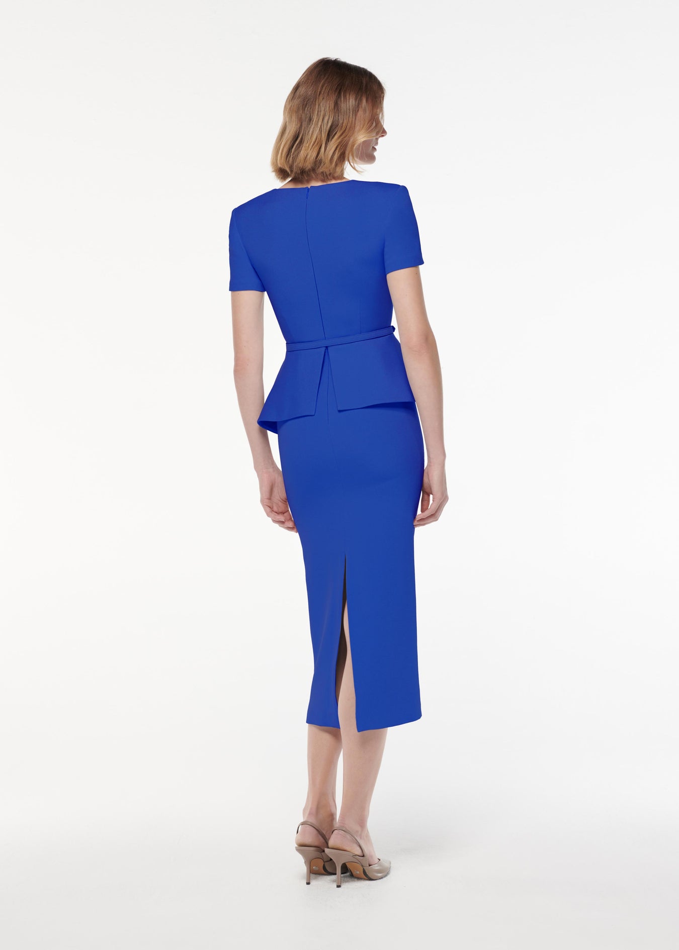 A photograph of a woman wearing a Short Sleeve Stretch Wool Silk Midi Dress in Blue