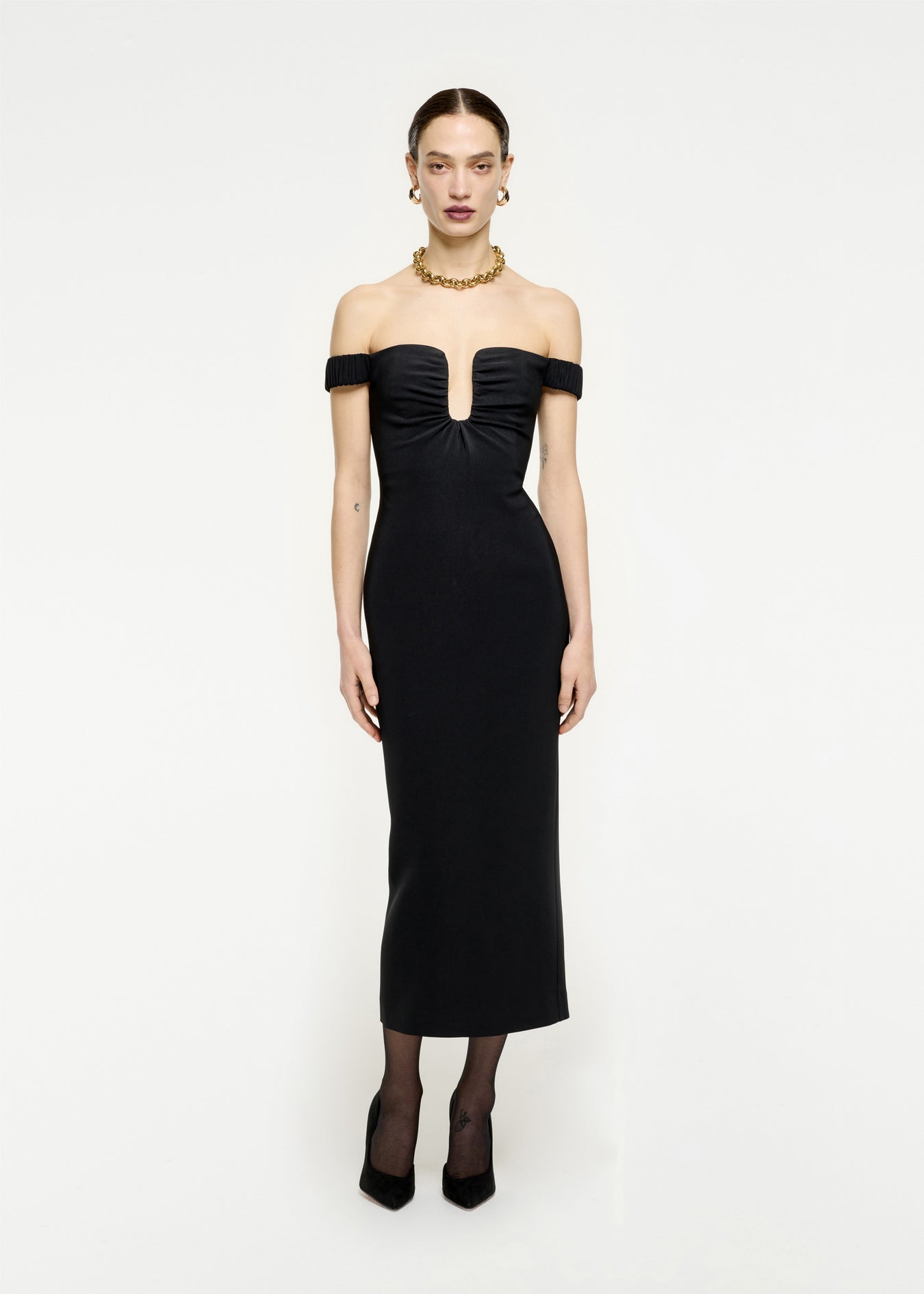 Woman wearing the Off The Shoulder Stretch Cady Midi Dress in Black