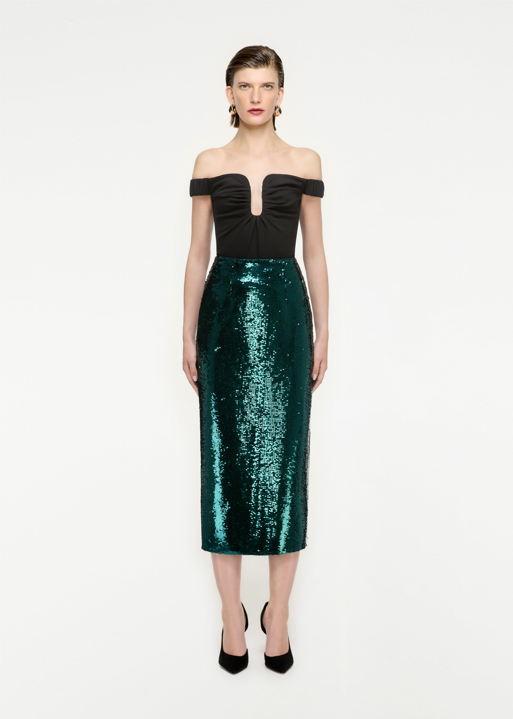 Woman wearing the Sequin Midi Skirt in Green