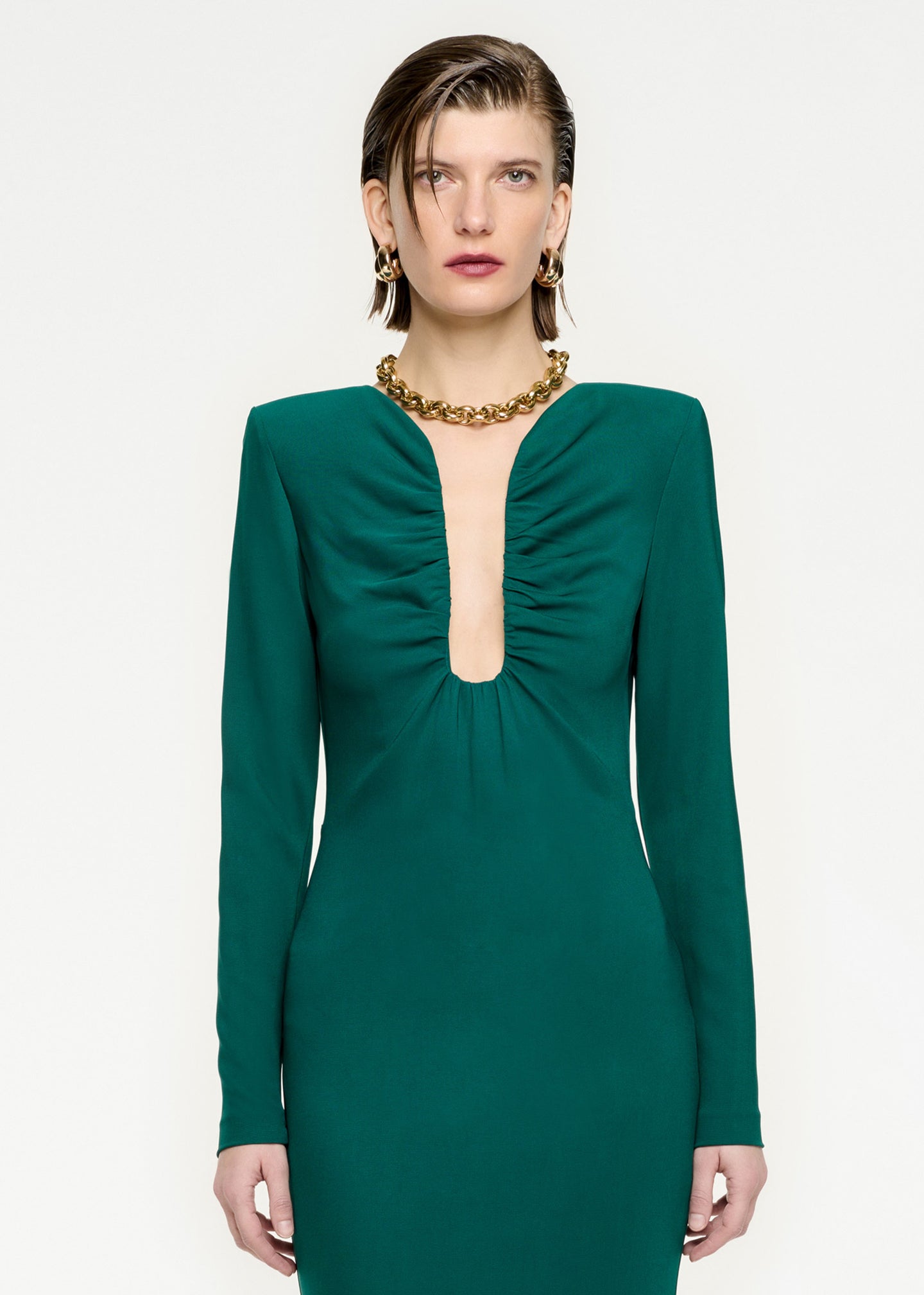A close up of a woman wearing the Long Sleeve Stretch Cady Maxi Dress in Green