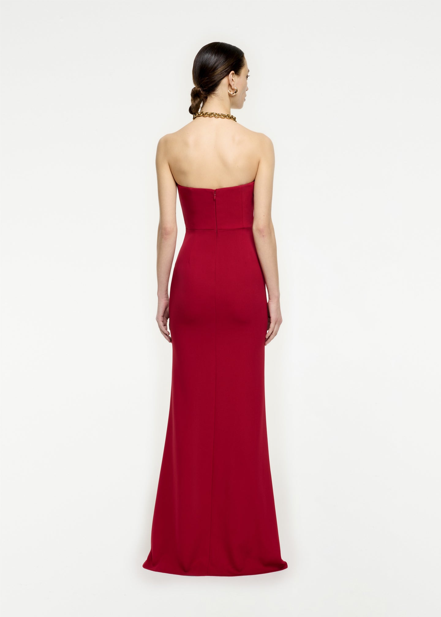 The back of a woman wearing the Strapless Stretch Cady Maxi Dress in Red