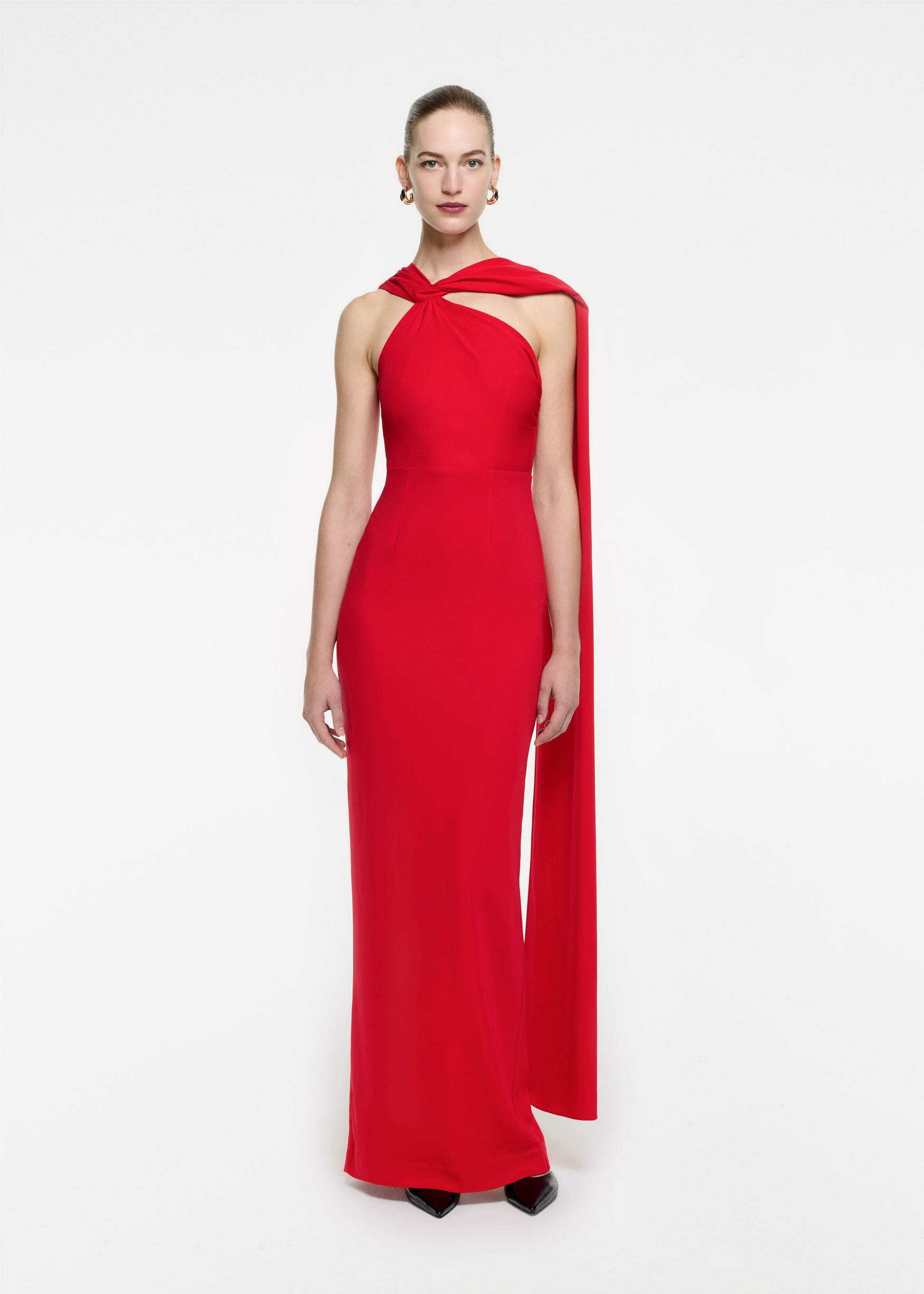 Woman wearing the Asymmetric Stretch Cady Maxi Dress in Red