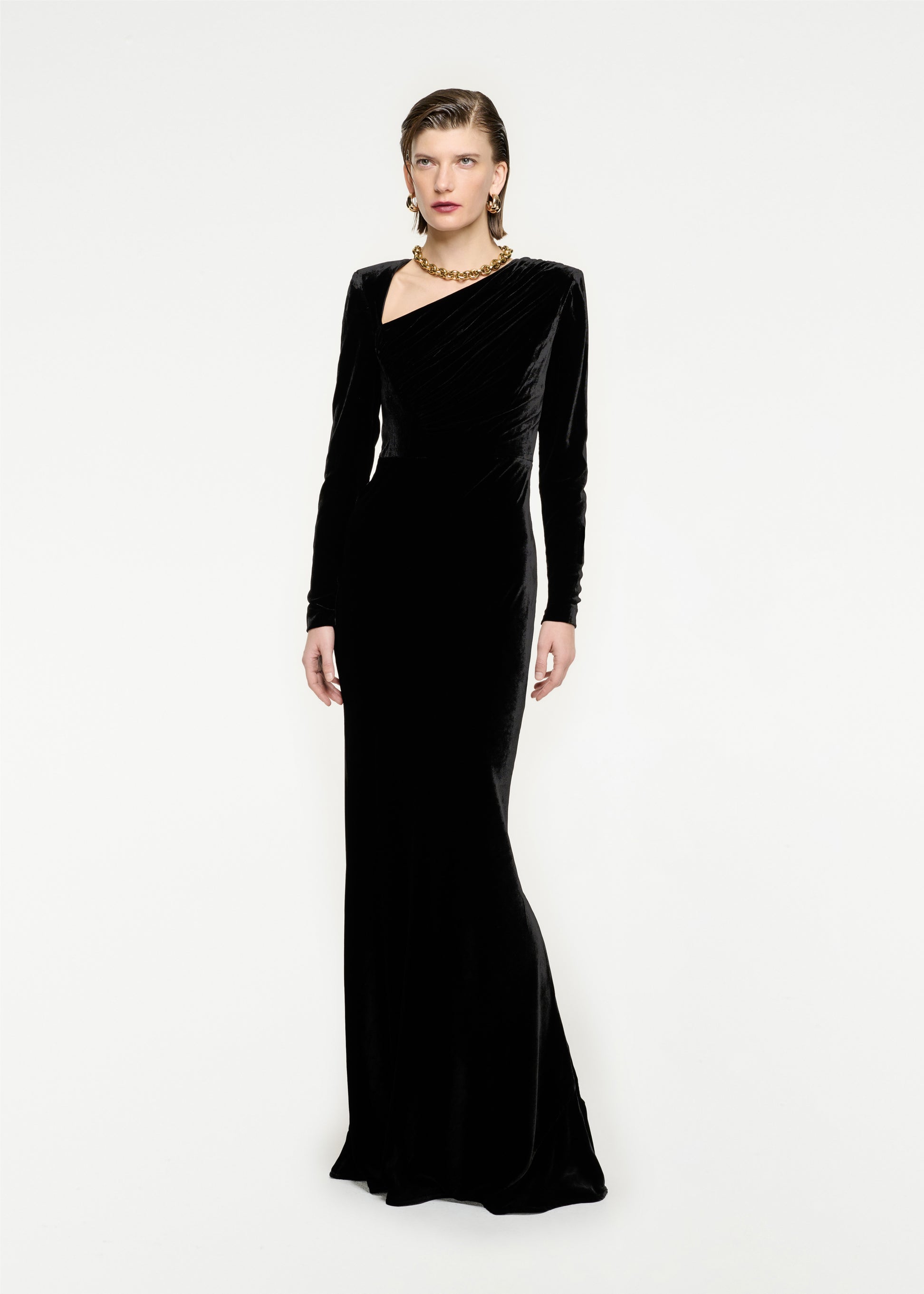 Woman wearing the Long Sleeve Velvet Maxi Dress in Black