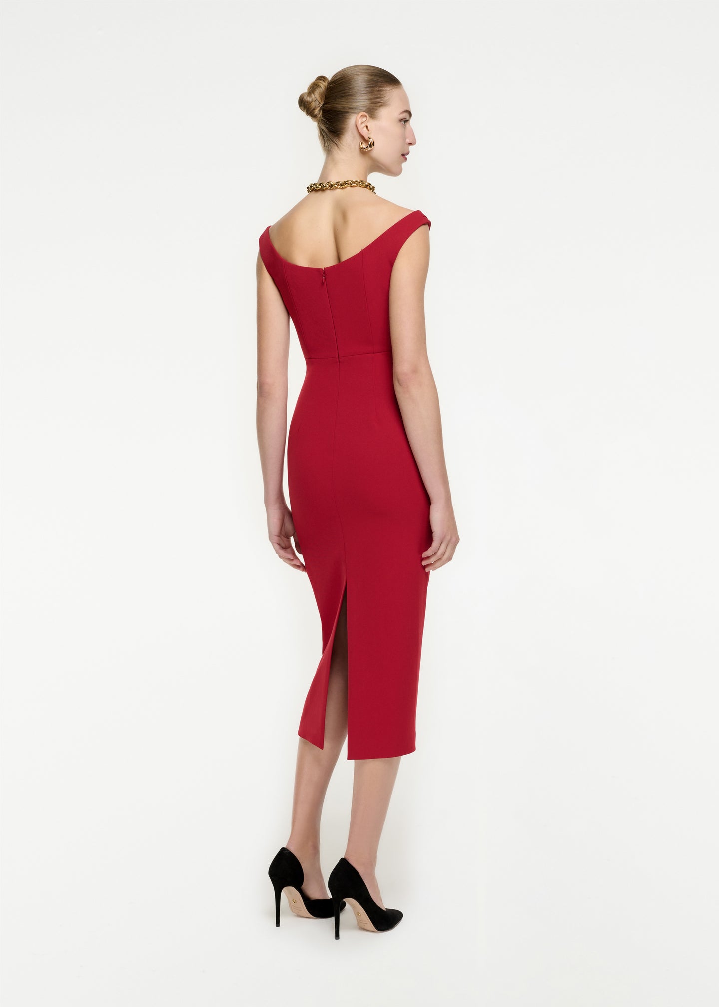 The back of a woman wearing the Off The Shoulder Stretch Cady Midi Dress in Red