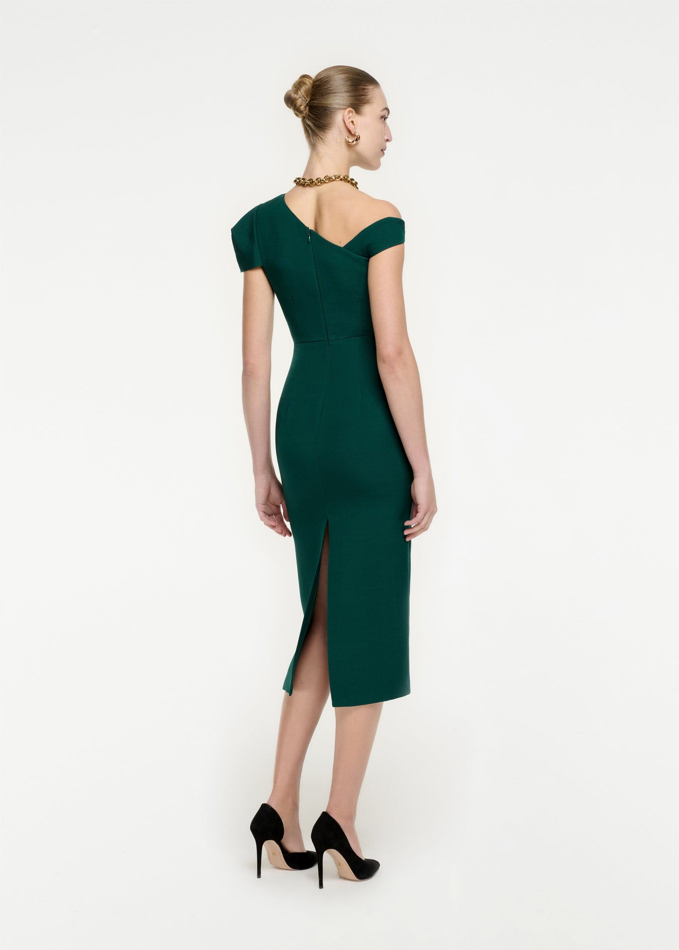 The back of a woman wearing the Asymmetric Wool Silk Midi Dress in Green