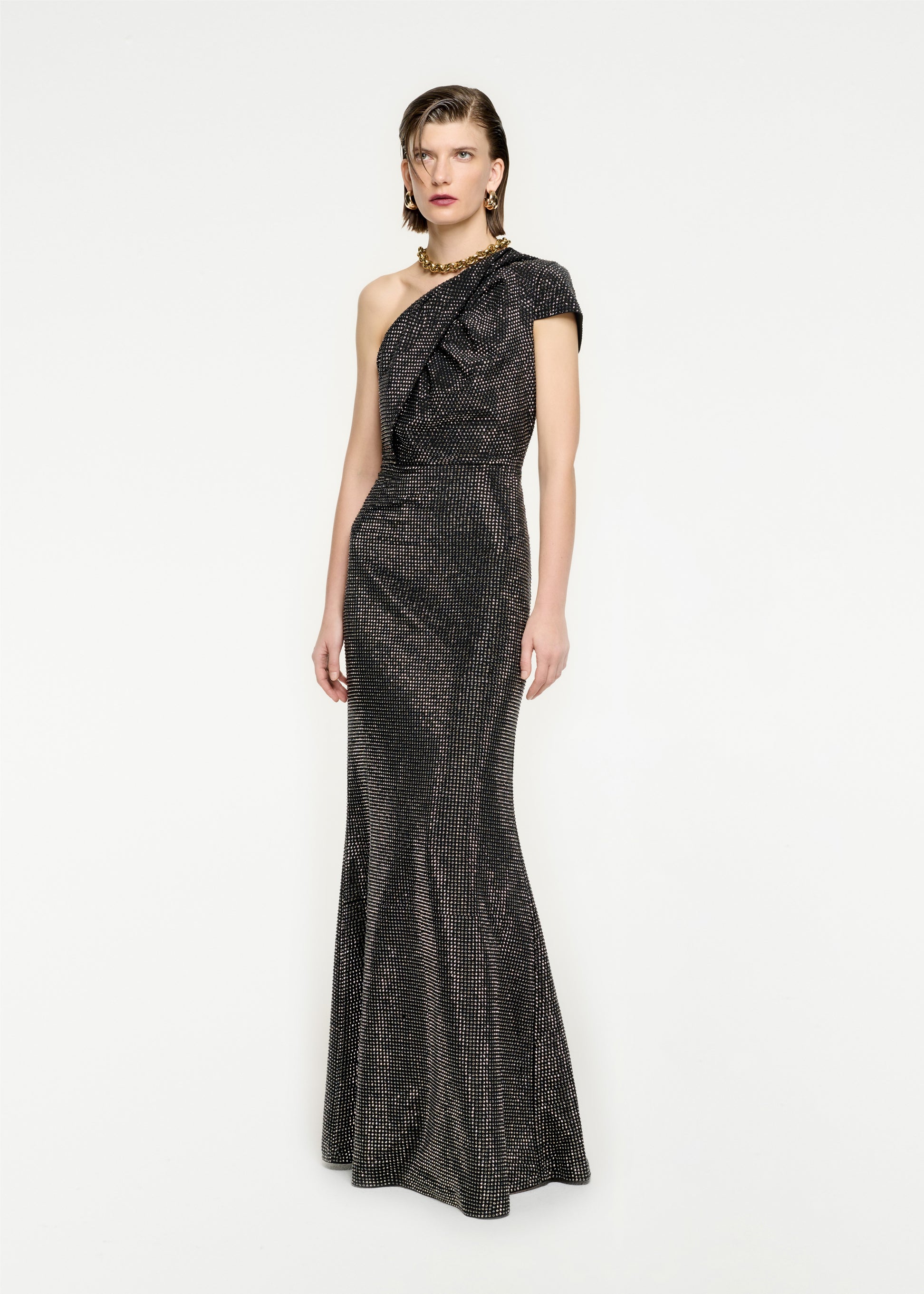 Woman wearing the Asymmetric Diamante Maxi Dress in Black