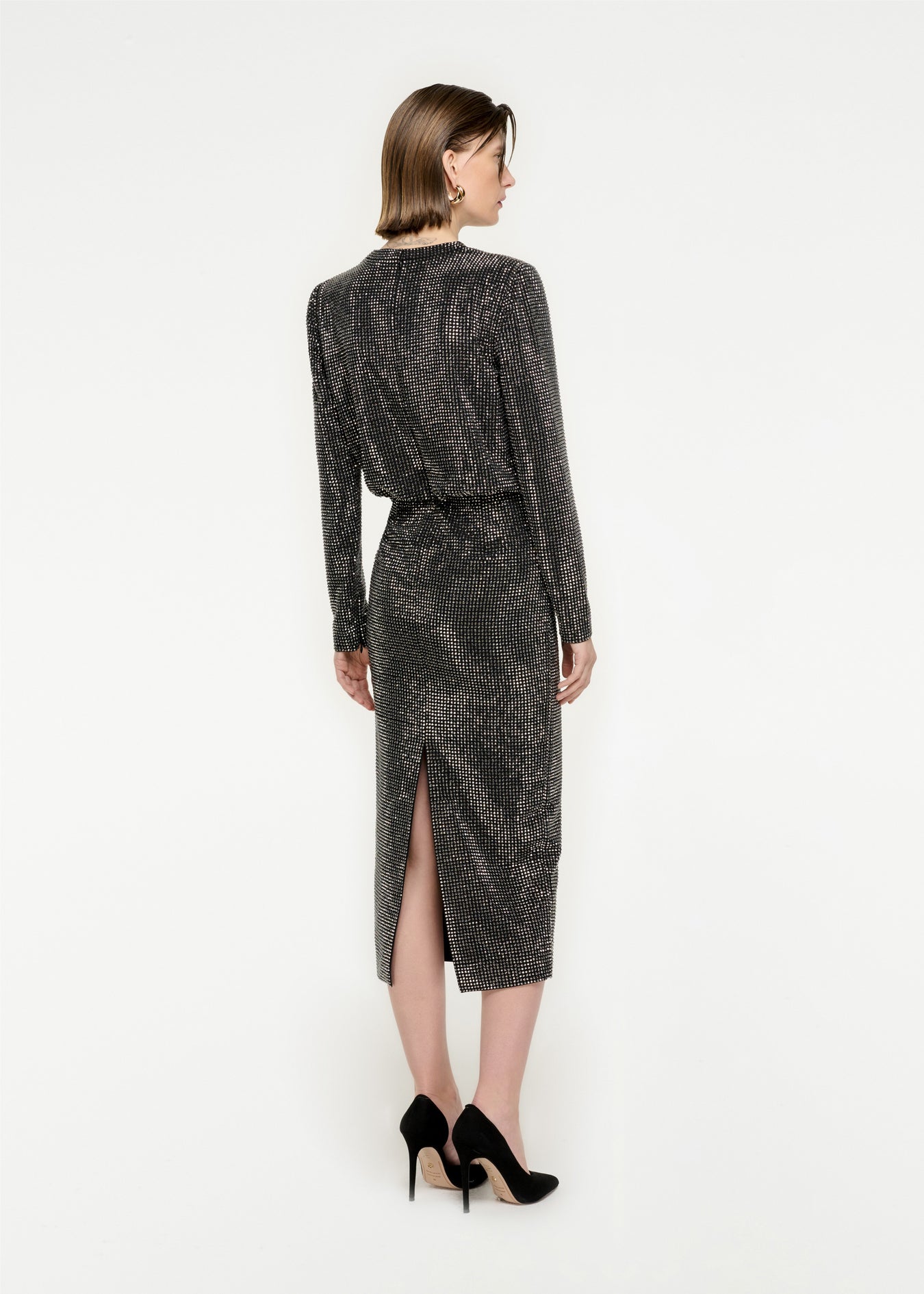The back of a woman wearing the Long Sleeve Diamante Midi Dress in Black