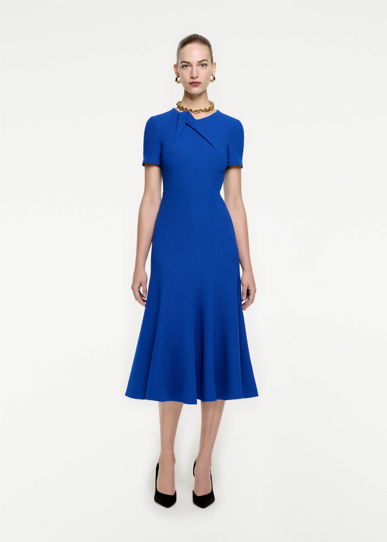 Front view of a model wearing the Short Sleeve Wool Crepe Midi Dress in Blue