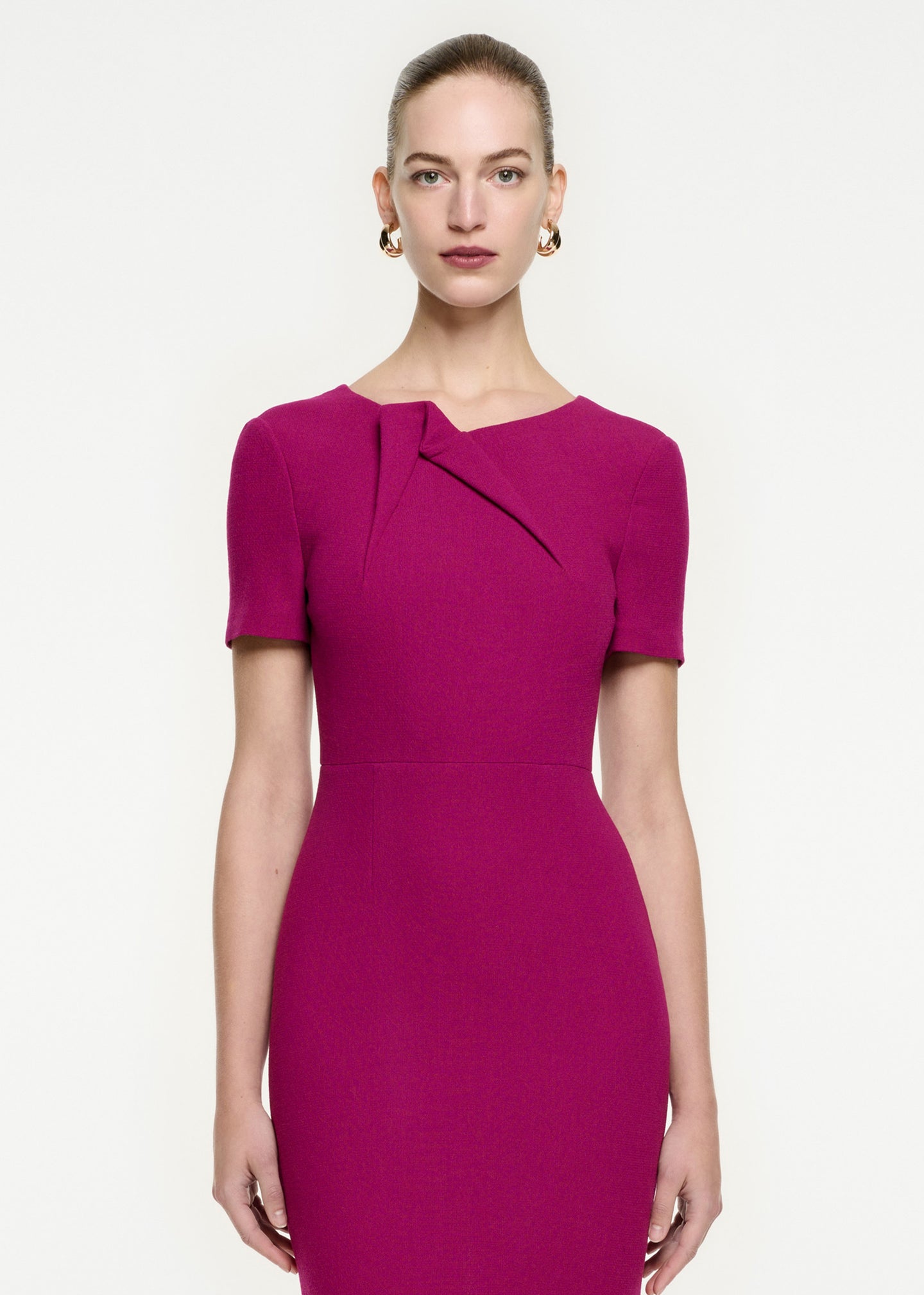 A close up of a woman wearing the Short Sleeve Wool Crepe Midi Dress in Purple