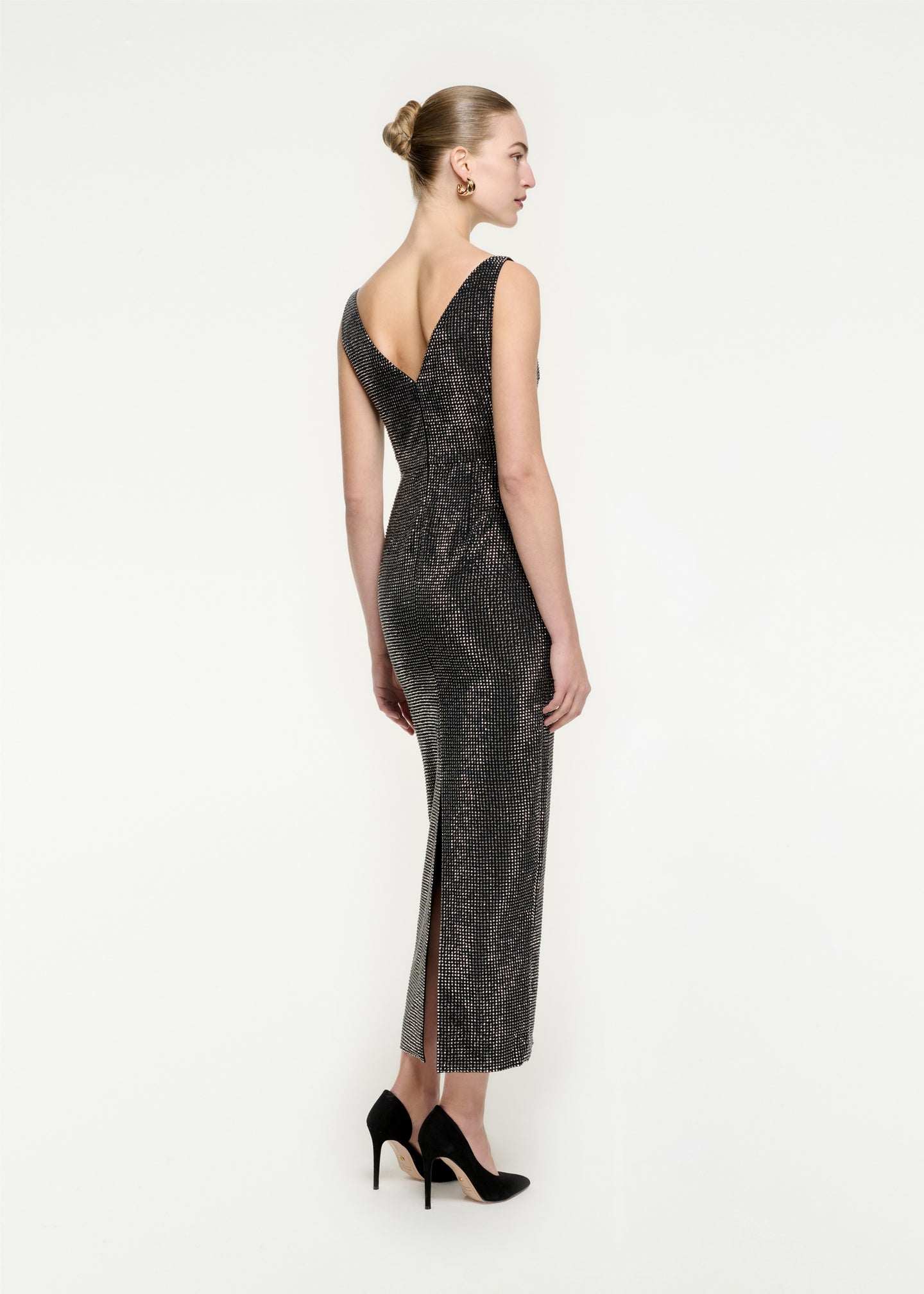 The back of a woman wearing the Diamante Maxi Dress in Black