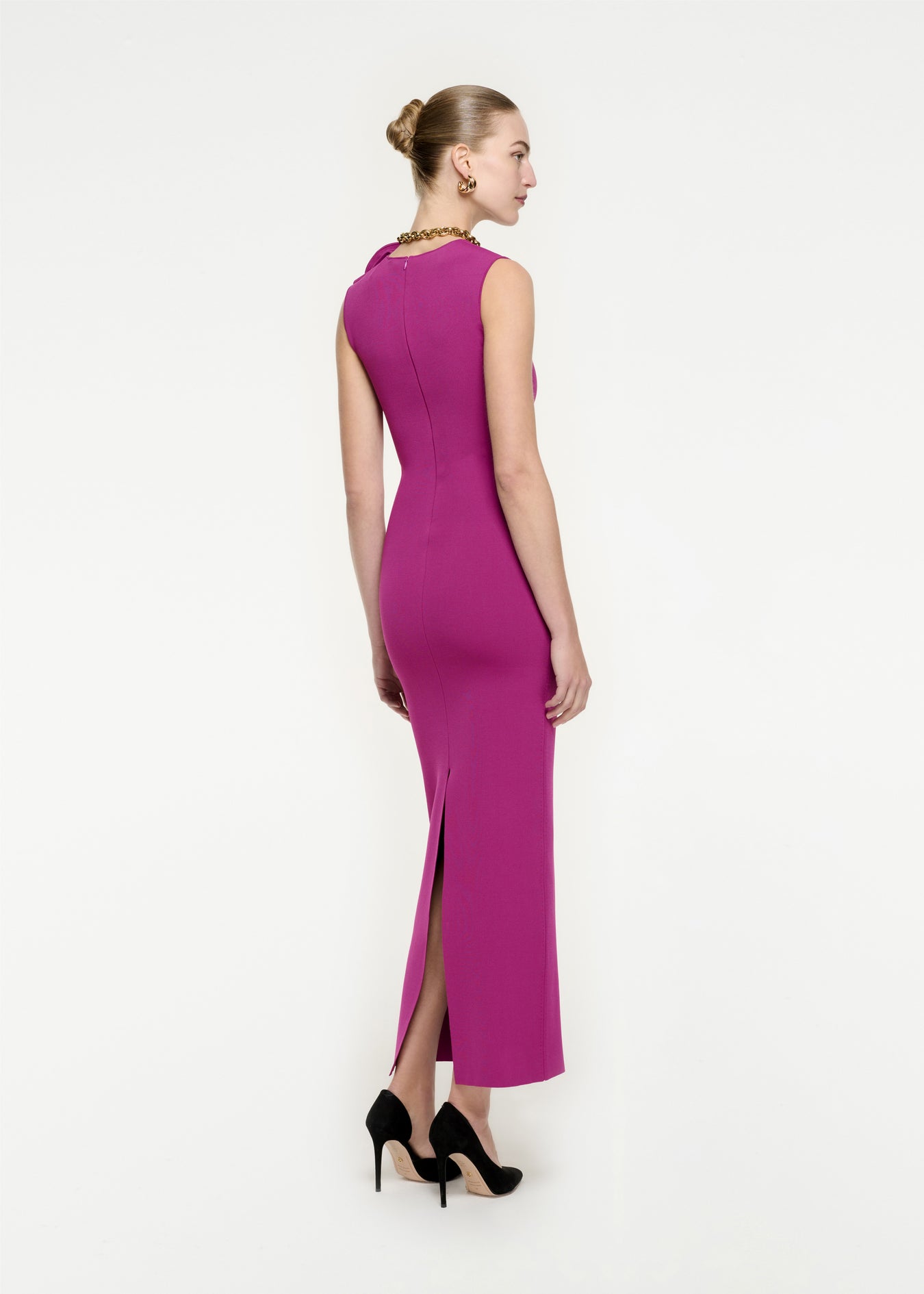 The back of a woman wearing the Knit Maxi Dress in Purple
