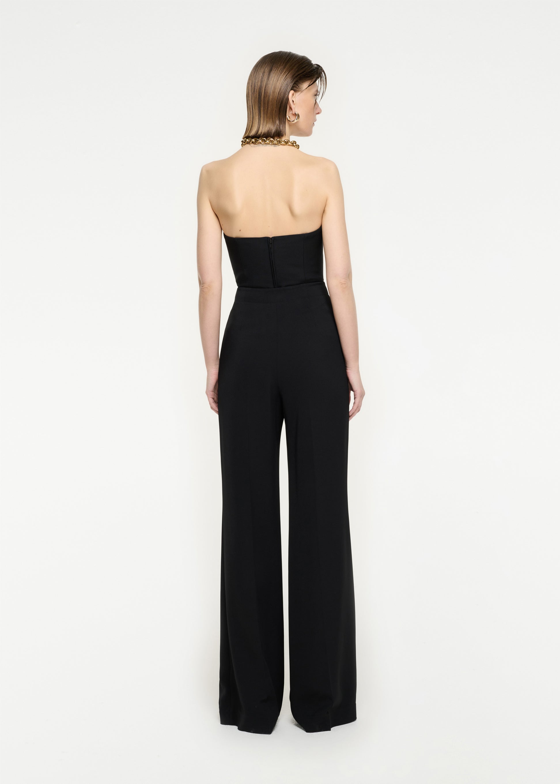 The back of a woman wearing the Strapless Wool Silk Top in Black