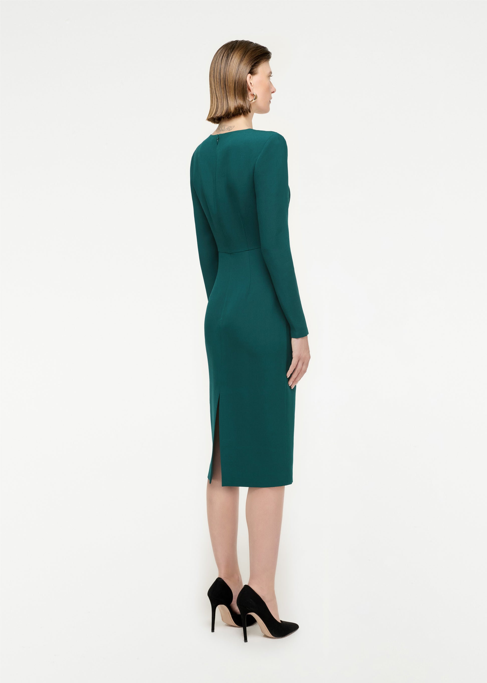 The back of a woman wearing the Long Sleeve Wool Silk Midi Dress in Green