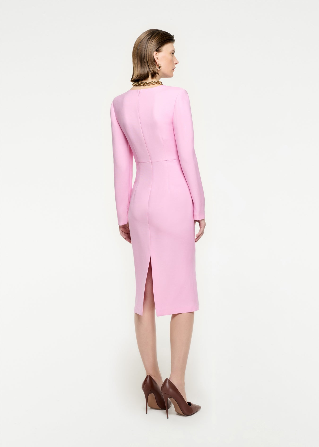 The back of a woman wearing the Long Sleeve Wool Silk Midi Dress in Pink