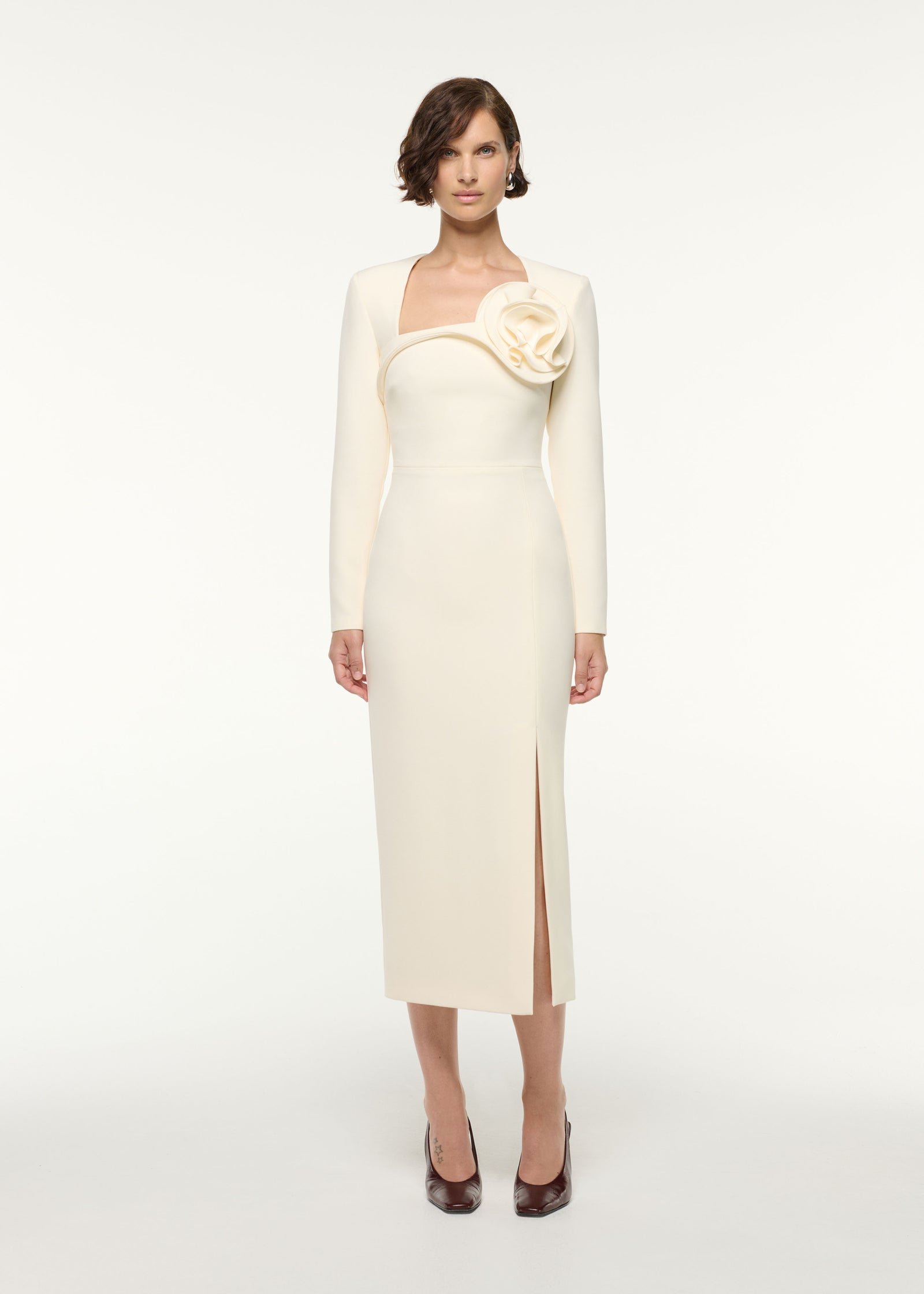 Front view of a model wearing the Flower Detail Cocktail Midi Dress in Cream