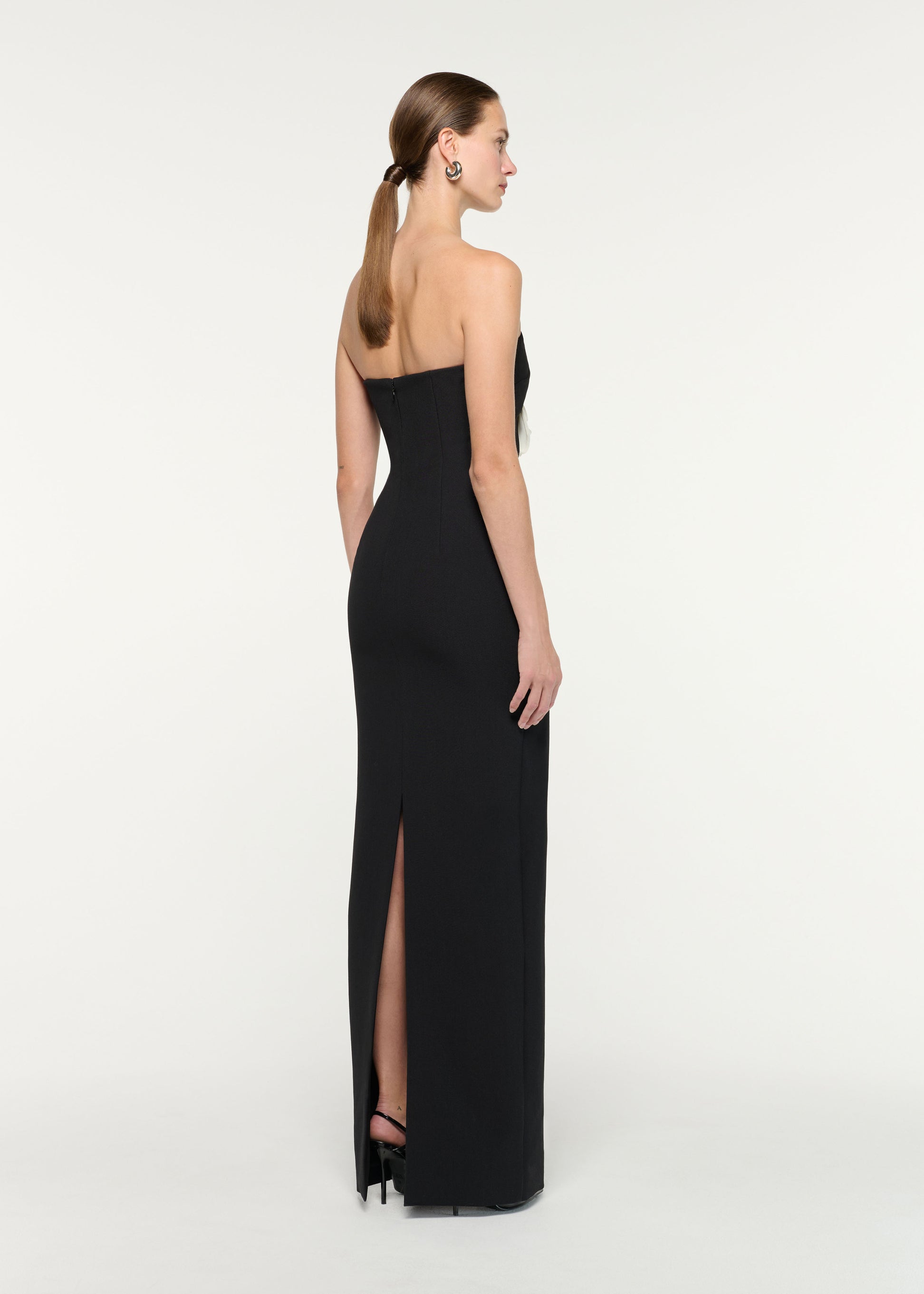 Back view of a model wearing the Strapless Monochrome Flower Gown
