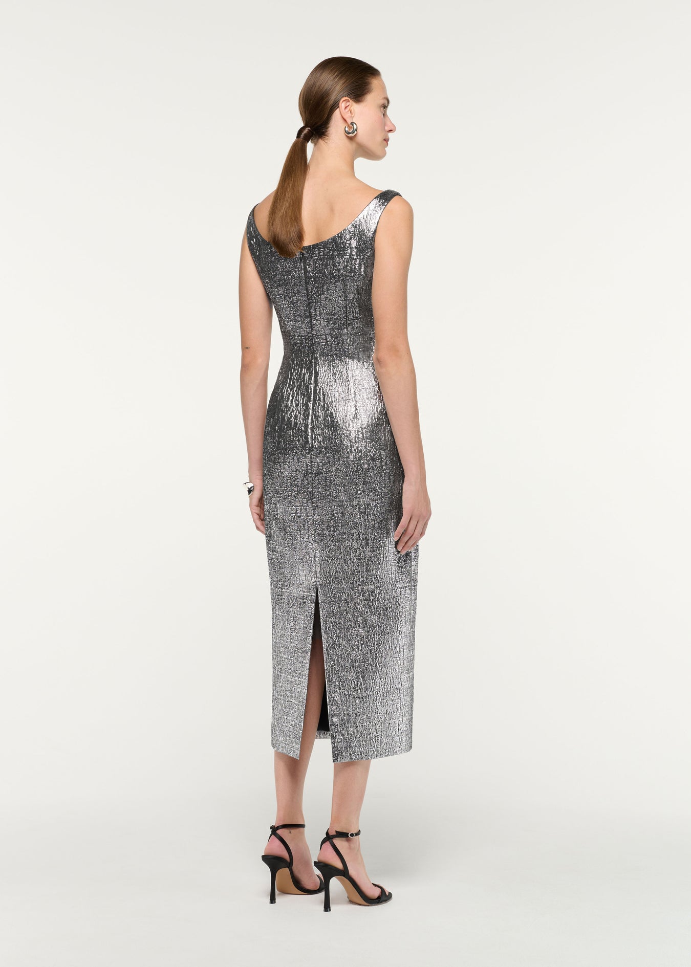 Back view of a model wearing the Metallic Jaquard Column Midi Dress