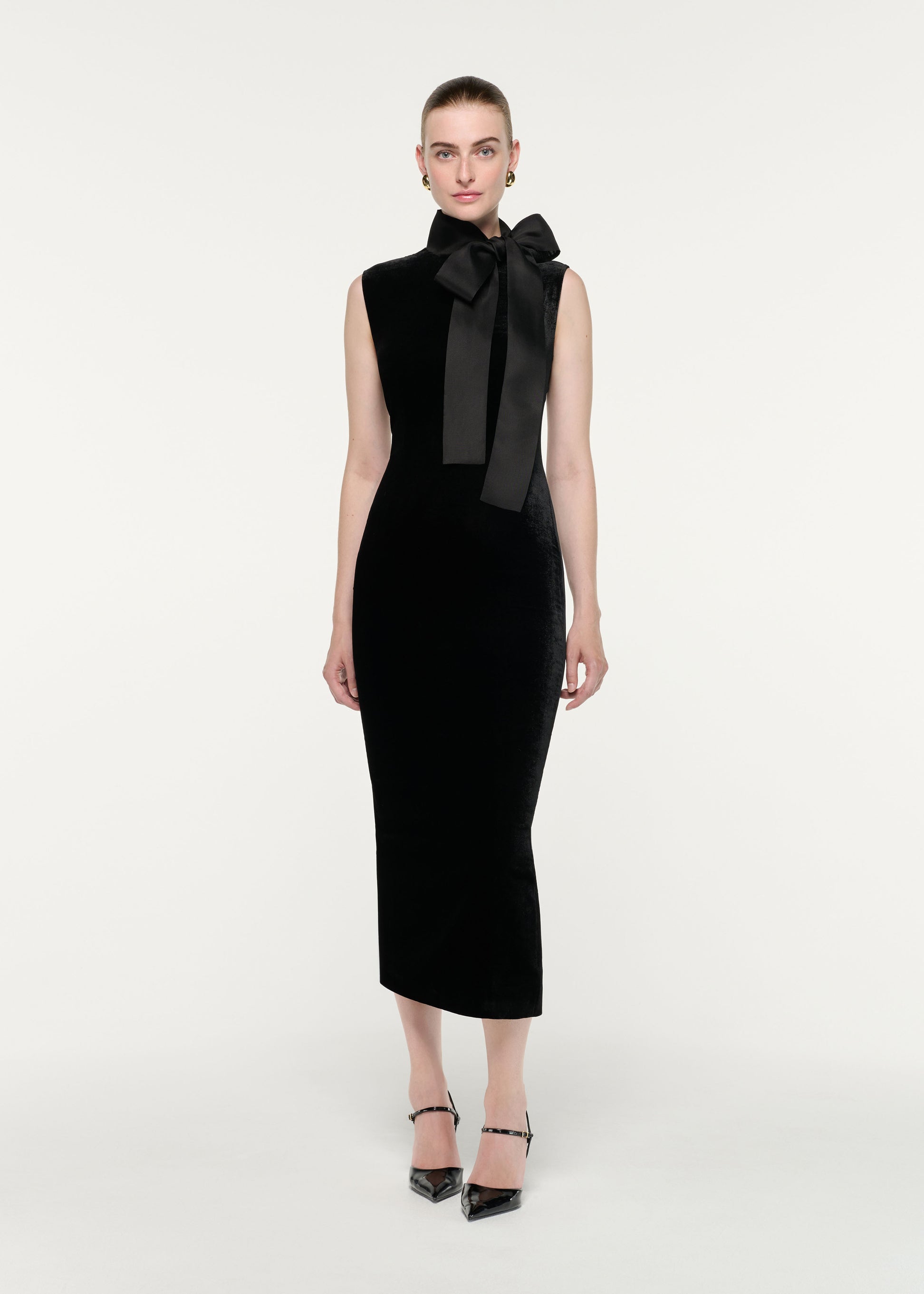 Front view of a model wearing the Velvet Midi Dress With Organza Bow Neck Tie