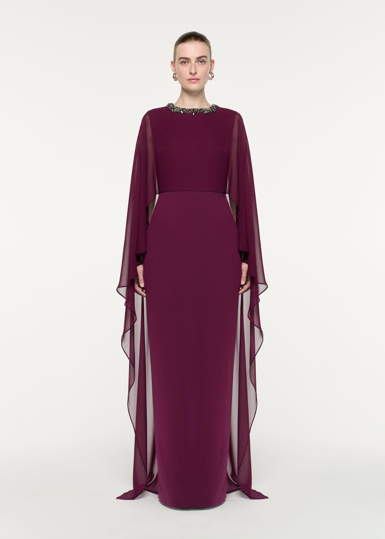 Front view of a model wearing the Embellished Chiffon Cape Gown
