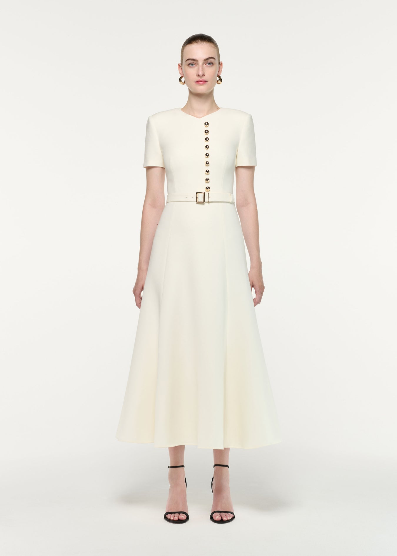 Front view of a model wearing the Gold Button Wool Silk Midi Dress