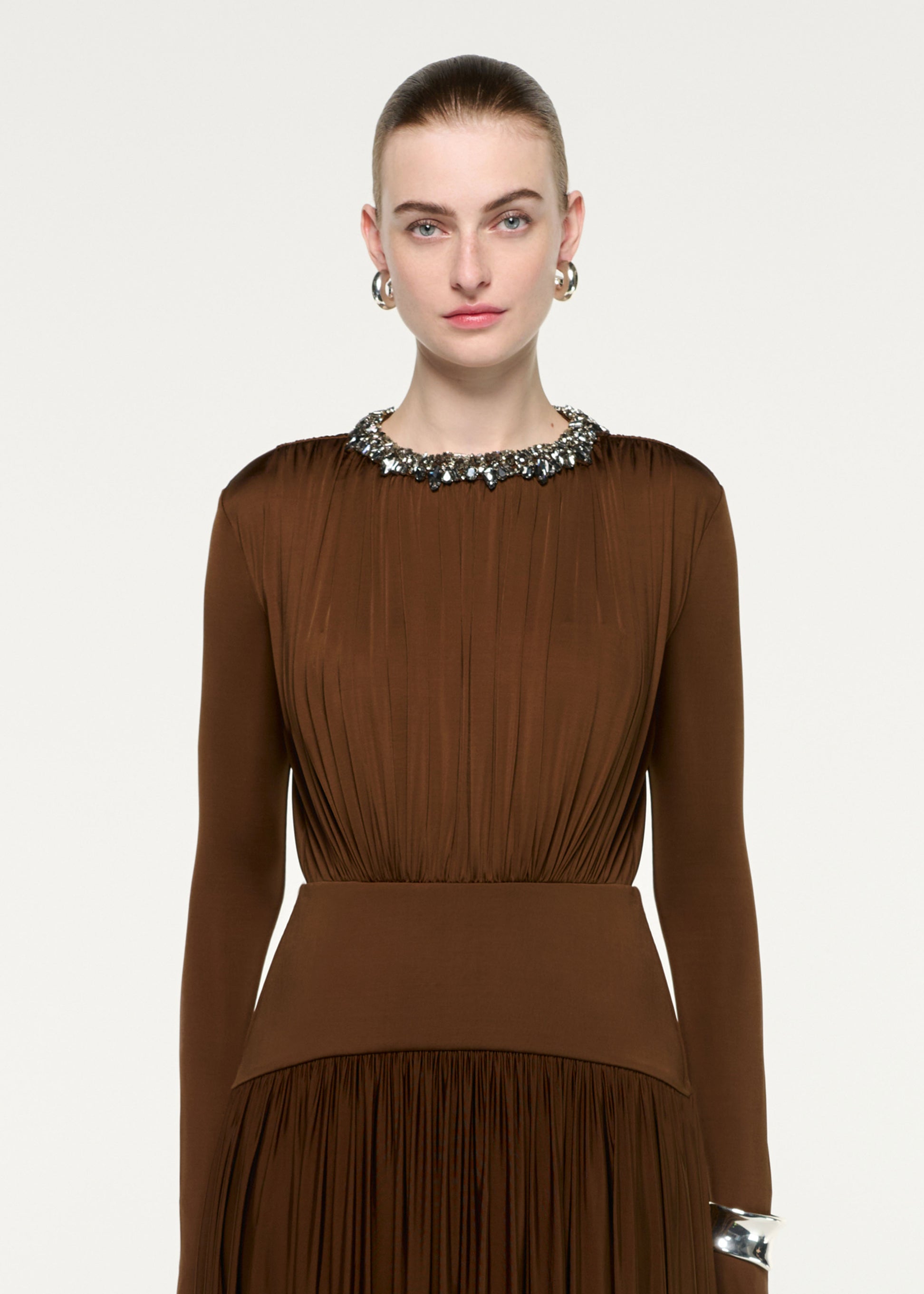 Close up of a model wearing the Embellished Neck Long Sleeve Gathered Dress