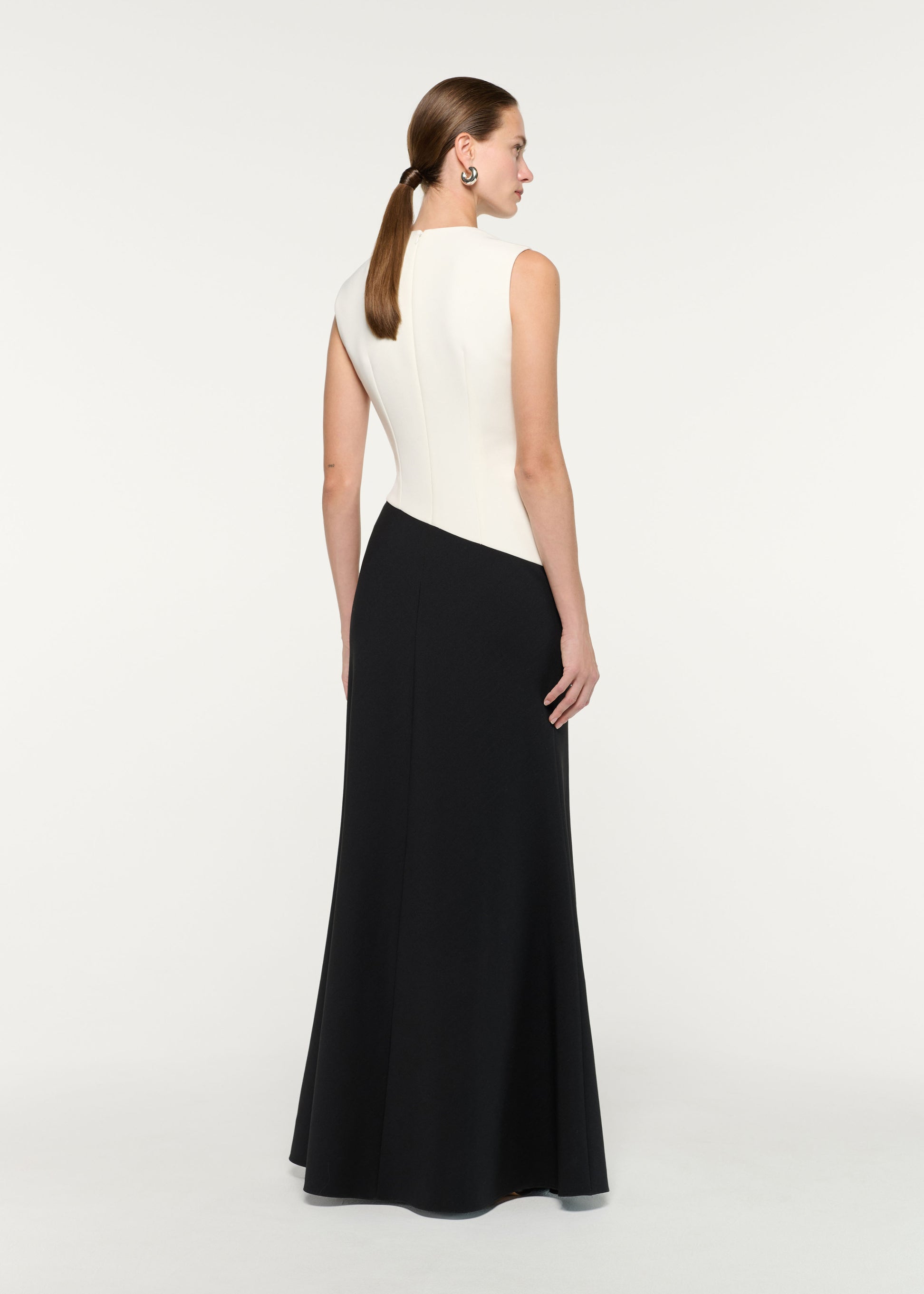 Back view of a model wearing the Flower Embroidery Sleeveless Gown