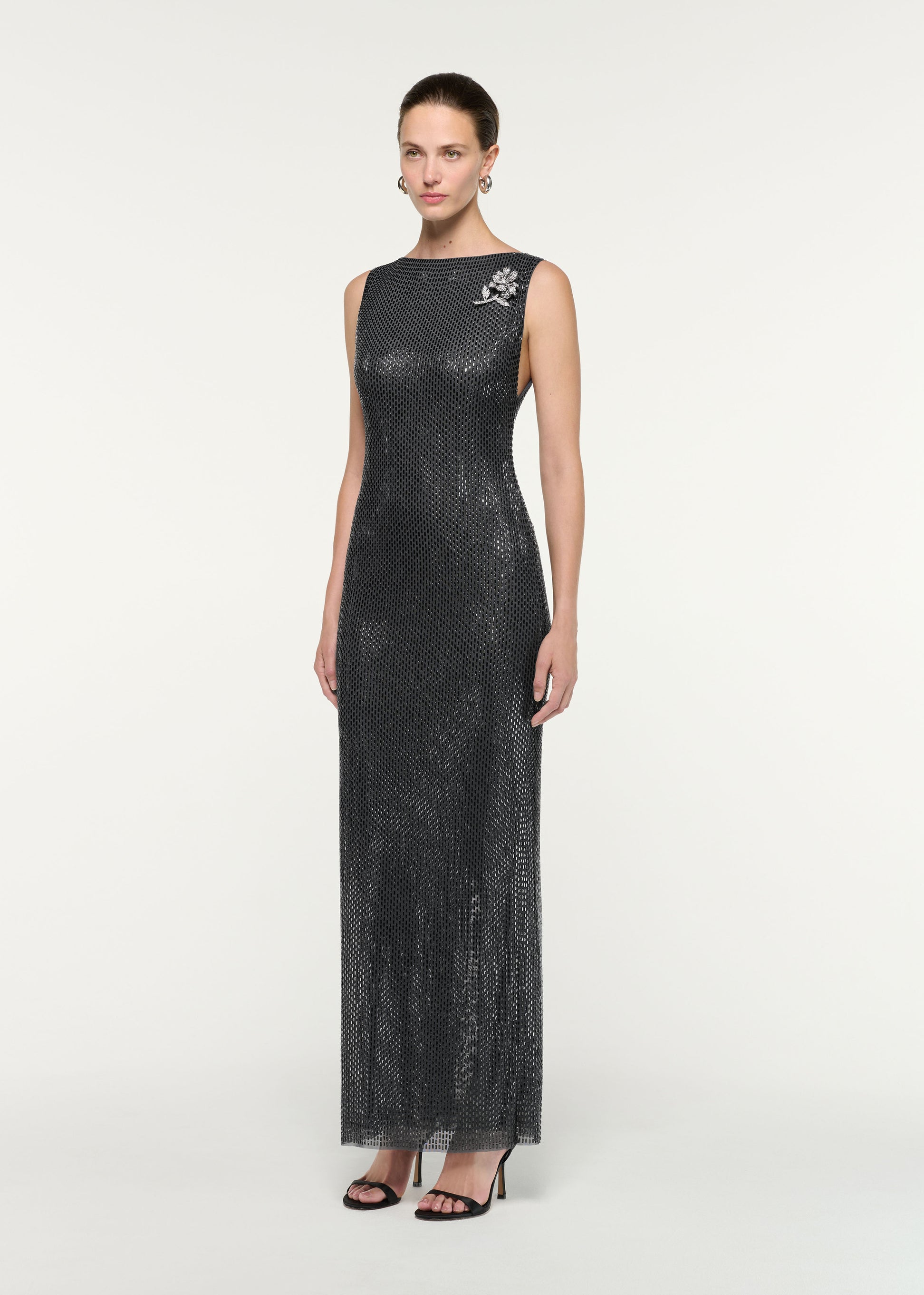 Side view of a model wearing the Flower Brooch Diamante Maxi Dress