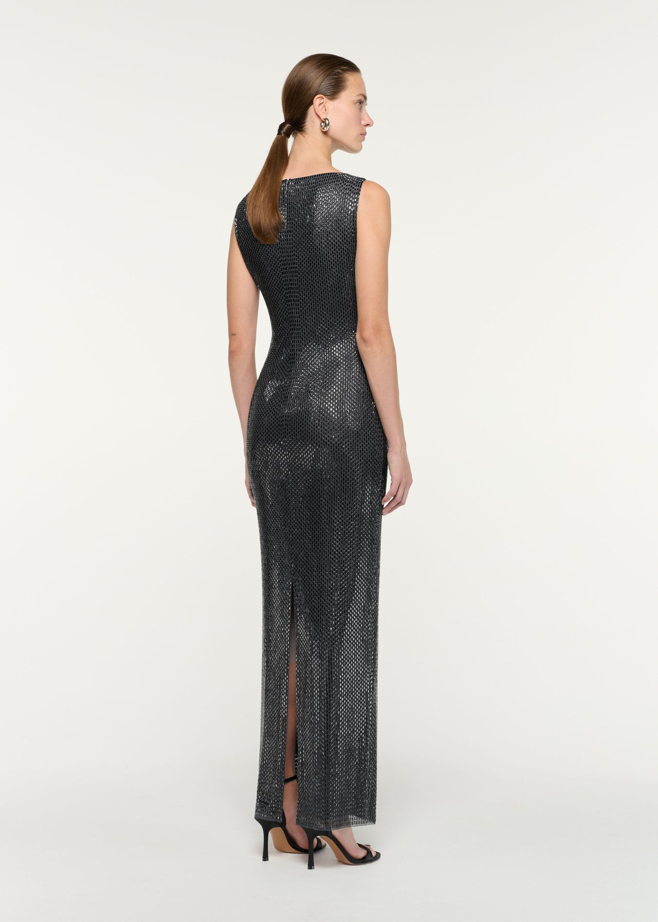 Back view of a model wearing the Flower Brooch Diamante Maxi Dress