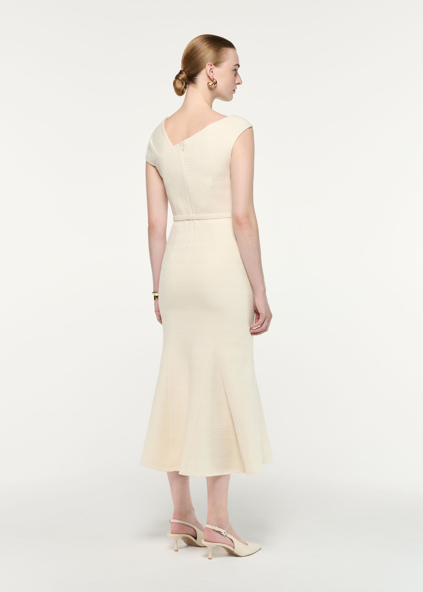 Back view of a model wearing the Asymmetric Neckline Boucle Midi Dress
