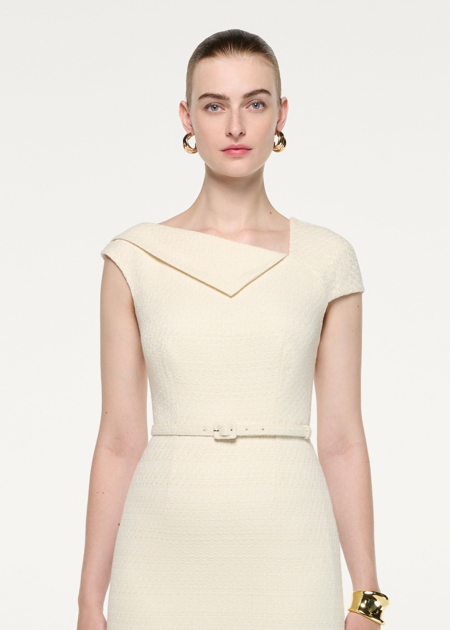 Close up of a model wearing the Asymmetric Neckline Boucle Midi Dress