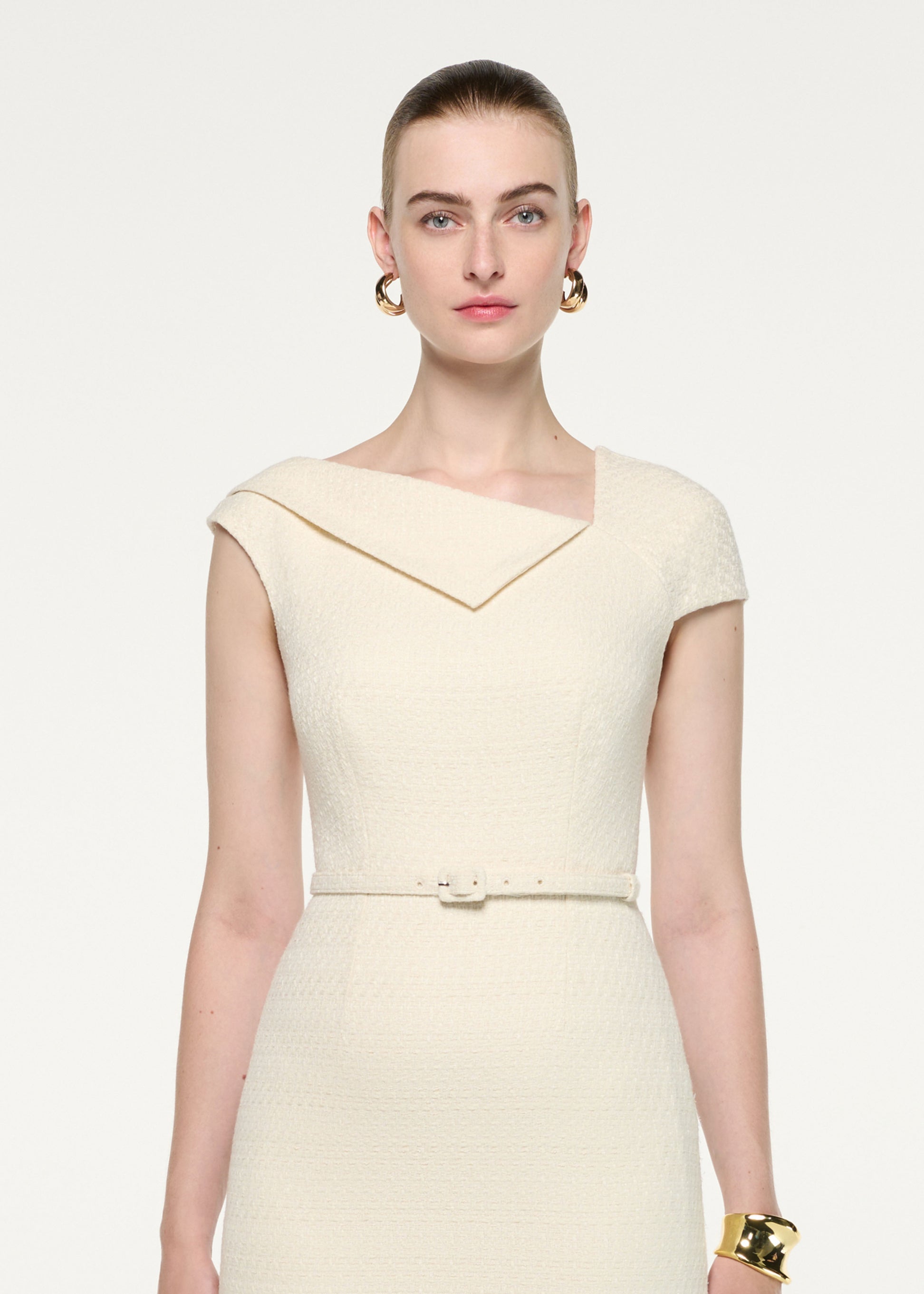 Close up of a model wearing the Asymmetric Neckline Boucle Midi Dress