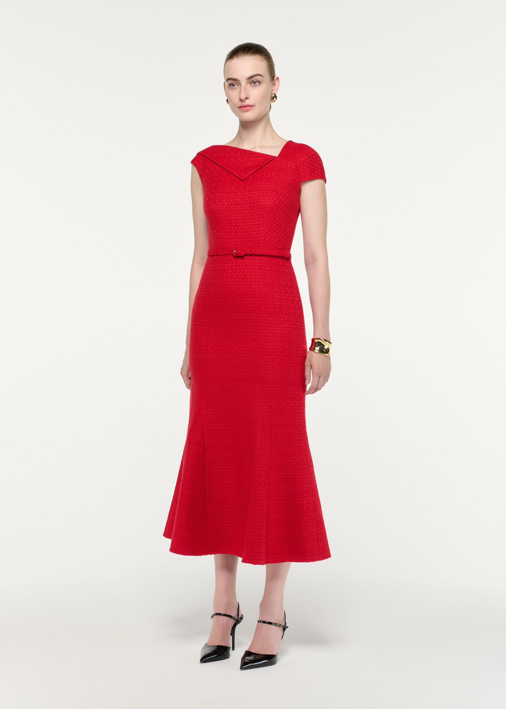 Side view of a model wearing the Asymmetric Neckline Boucle Midi Dress