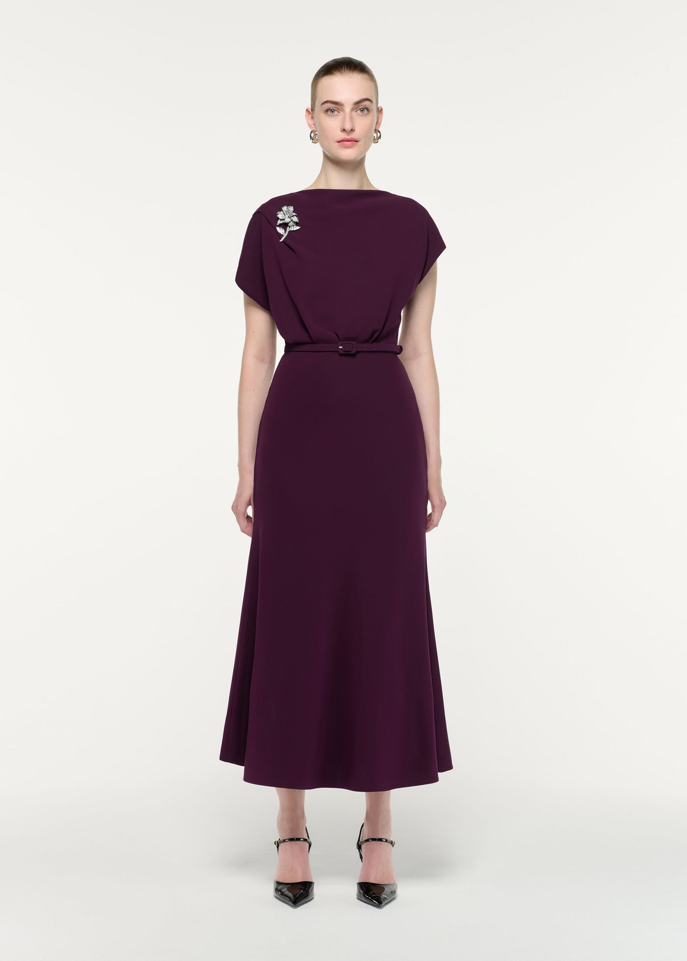 Front view of a model wearing the Flower Brooch Cady Midi Dress