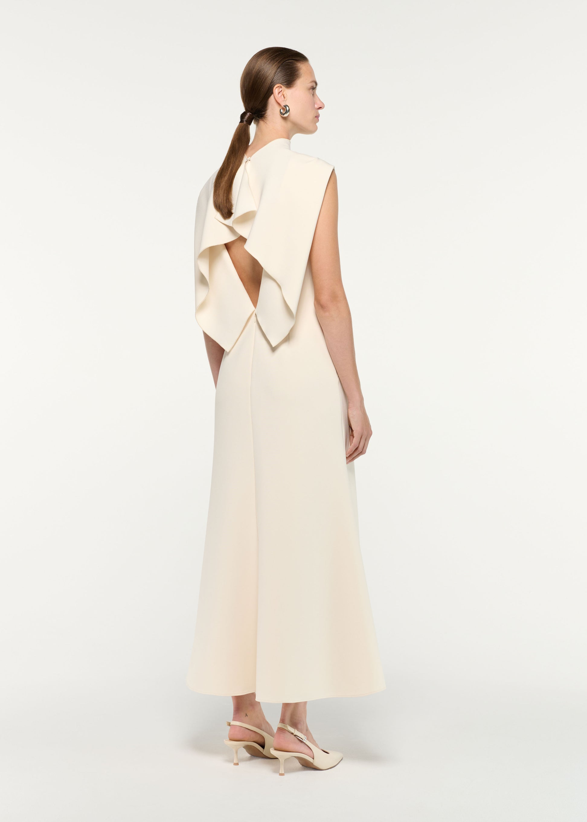 Back view of a model wearing the Flower Embroidery Crepe Midi Dress