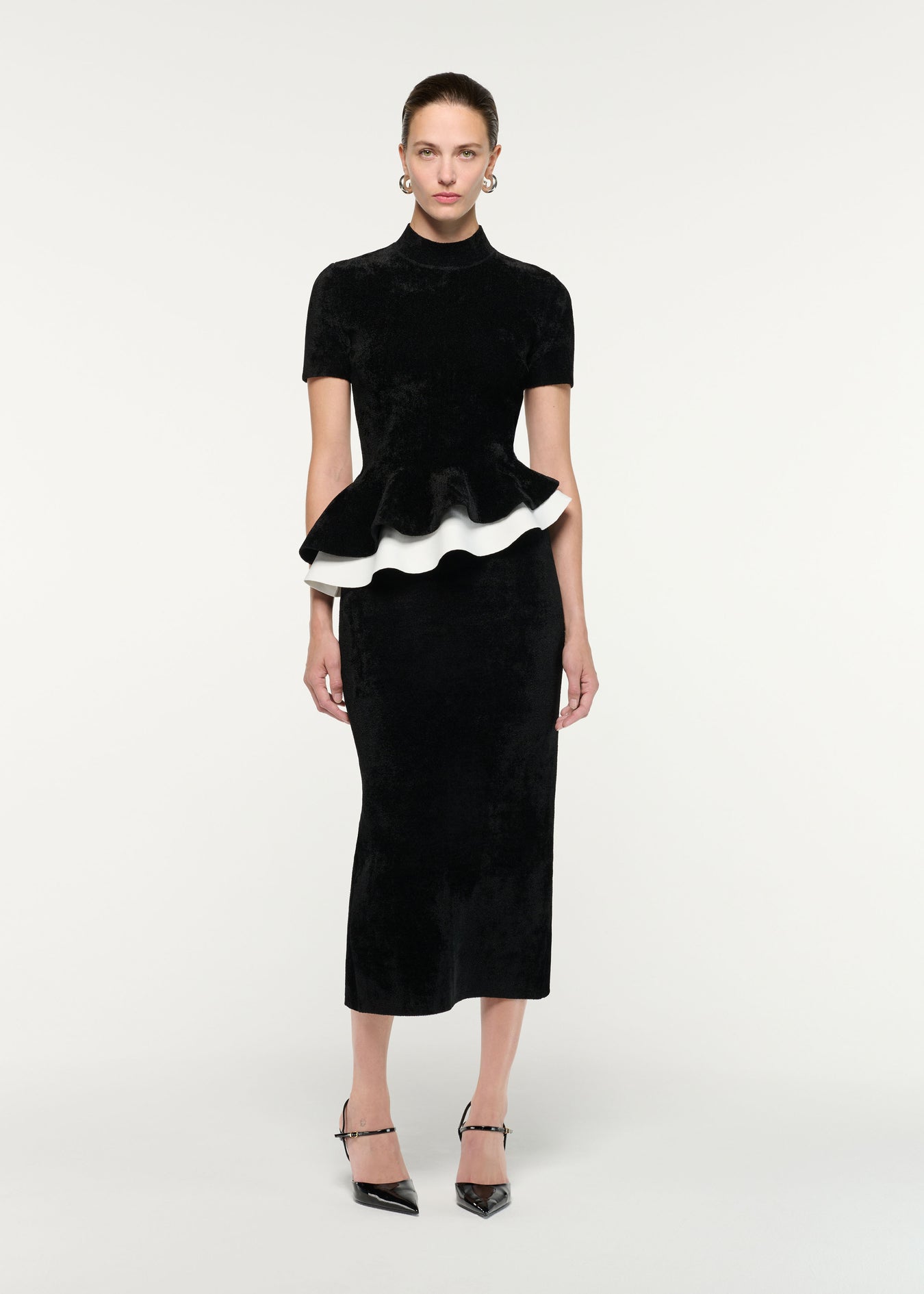 Front view of a model wearing the Short Sleeve Chenille Peplum Midi Dress