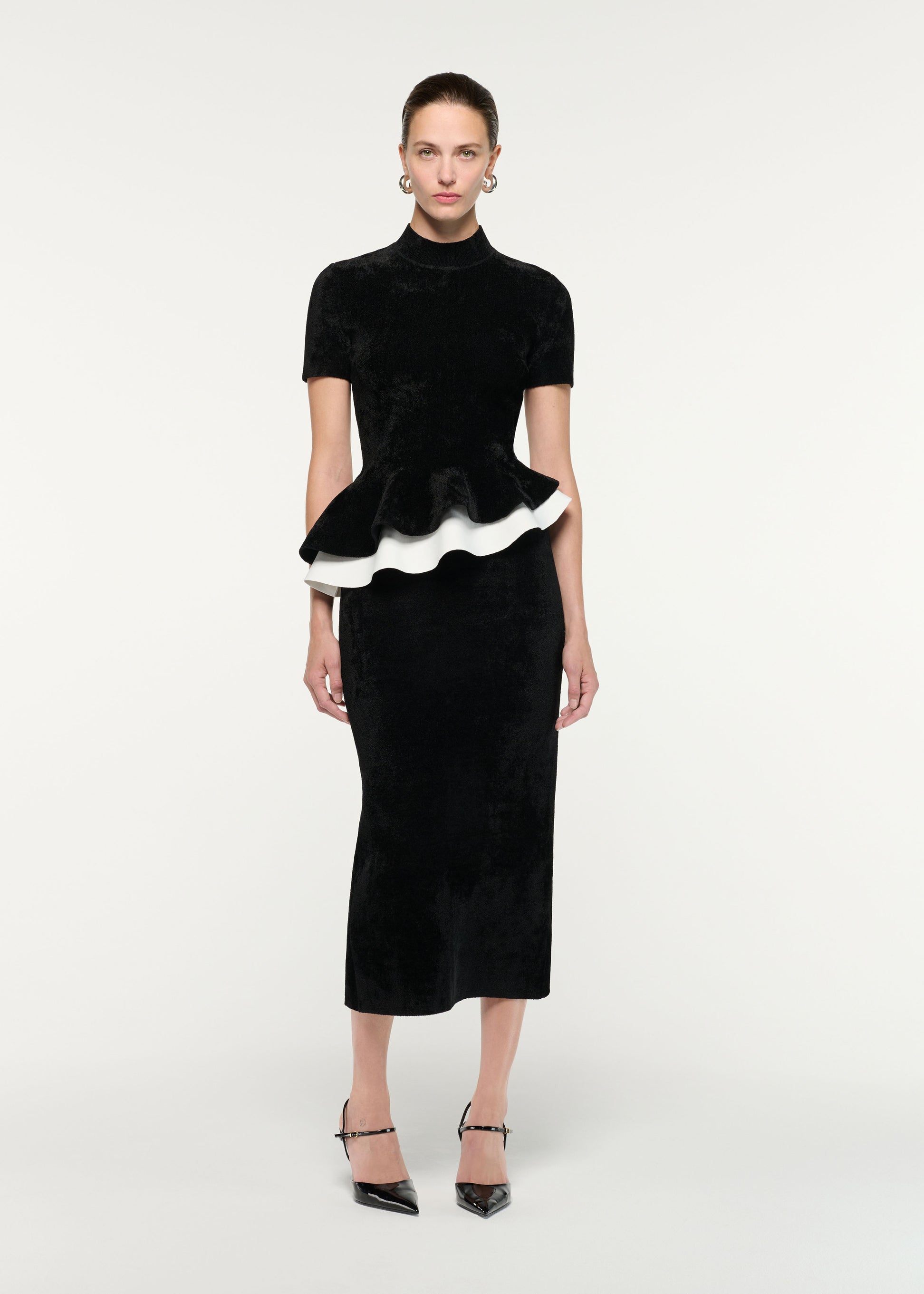 Front view of a model wearing the Short Sleeve Chenille Peplum Midi Dress