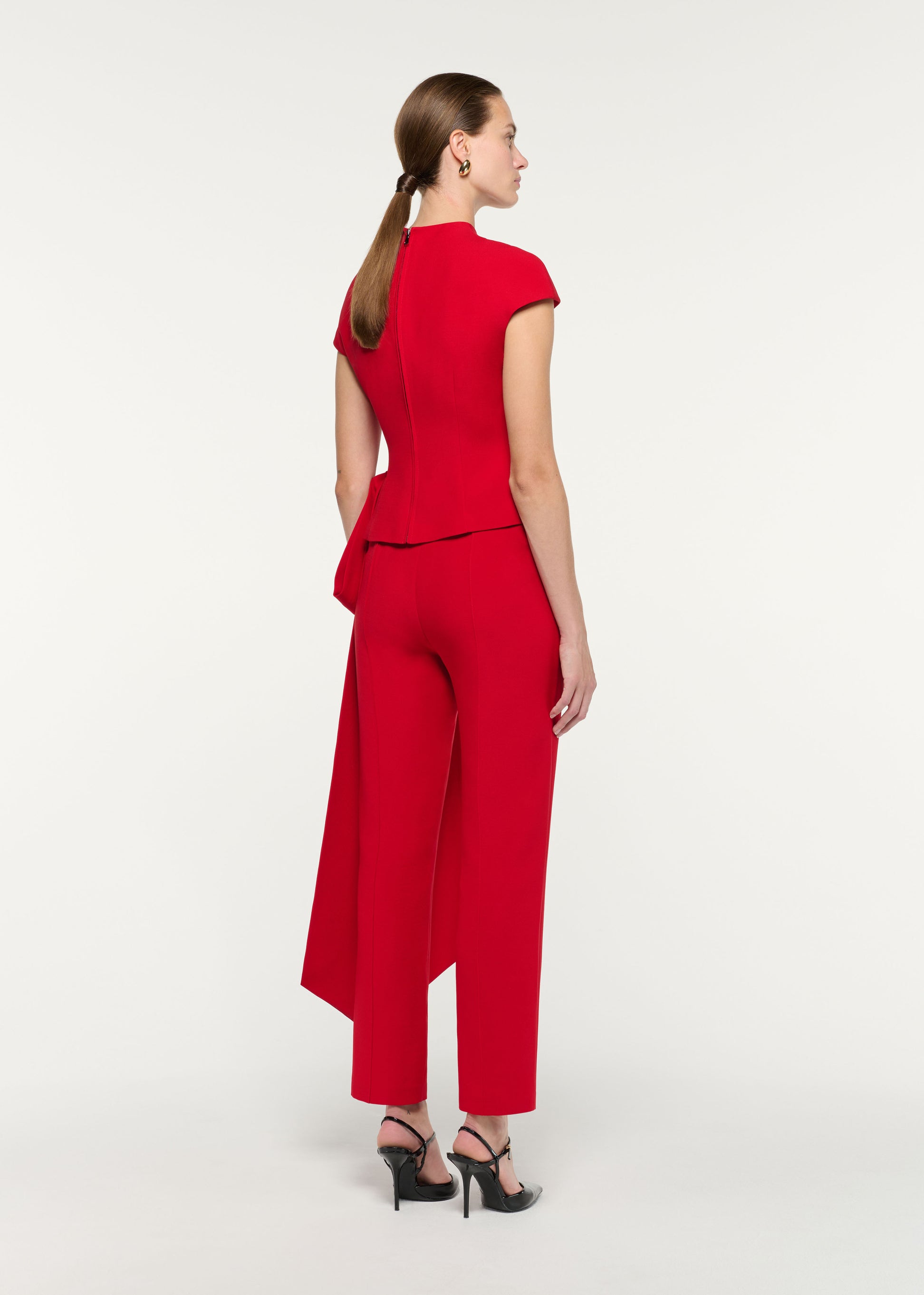 Back view of a model wearing the High Neck Wool Silk Bow Detail Top