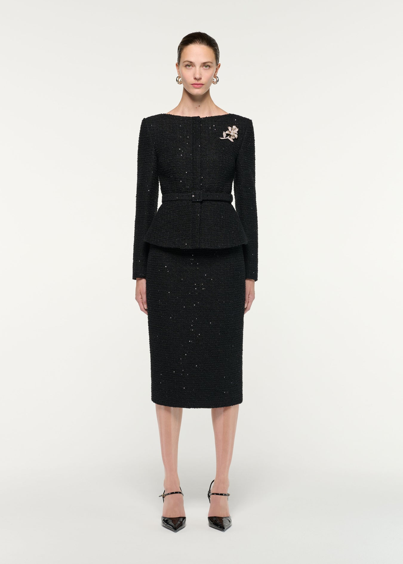 Front view of a model wearing the Flower Brooch Sequin Boucle Jacket