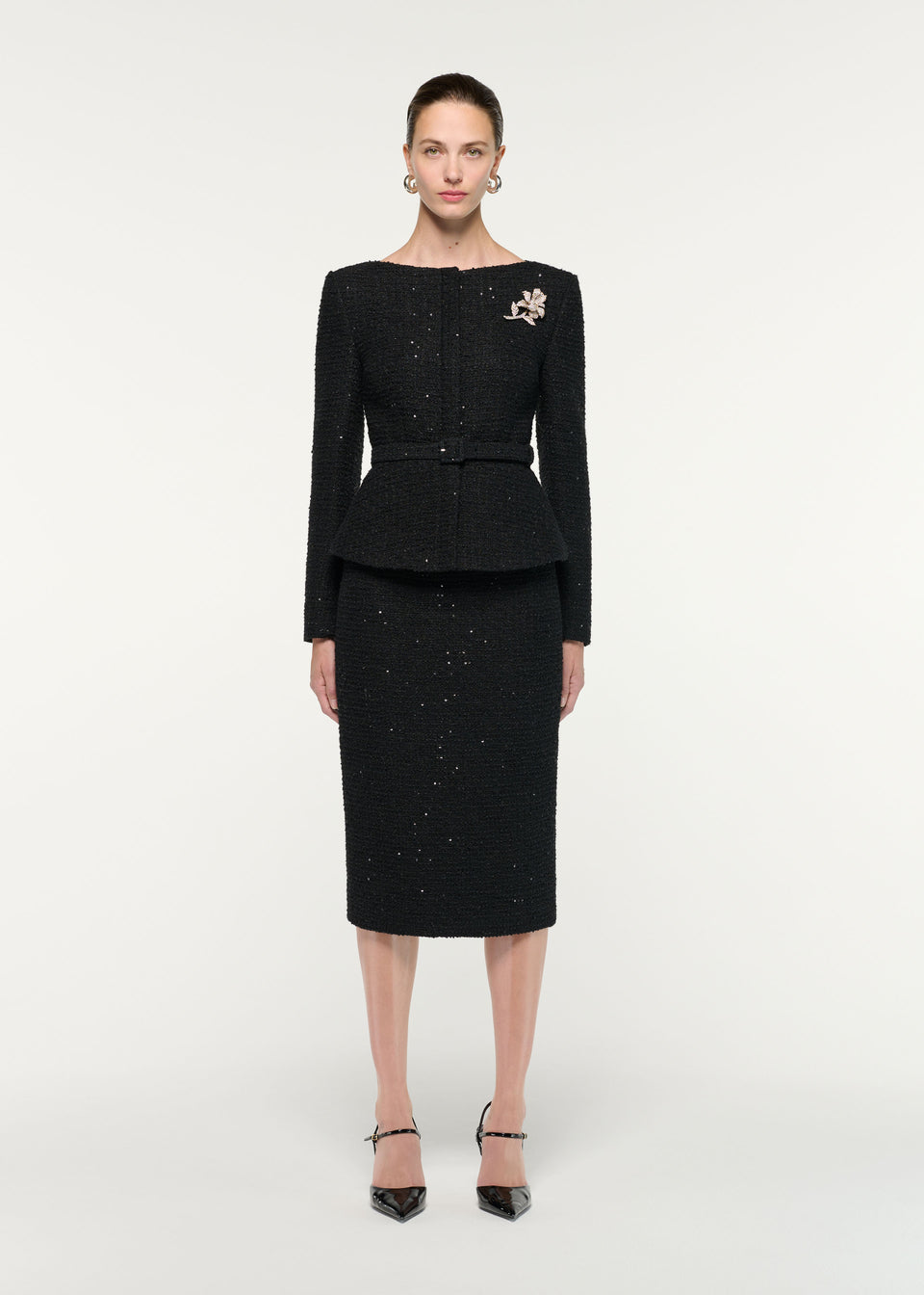 Front view of a model wearing the Sequin Boucle Midi Skirt