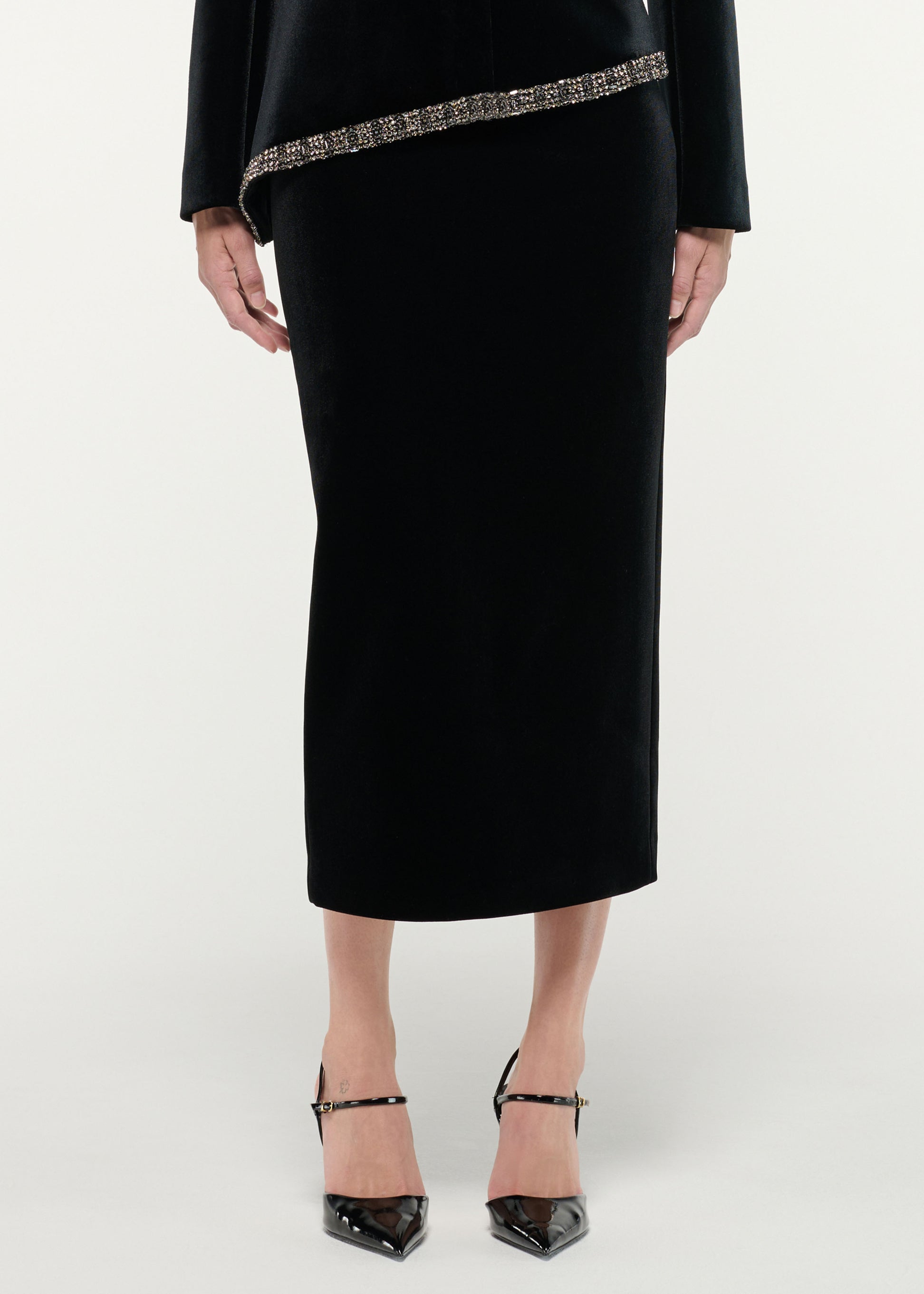 Close up of a model wearing the Velvet Midi Skirt