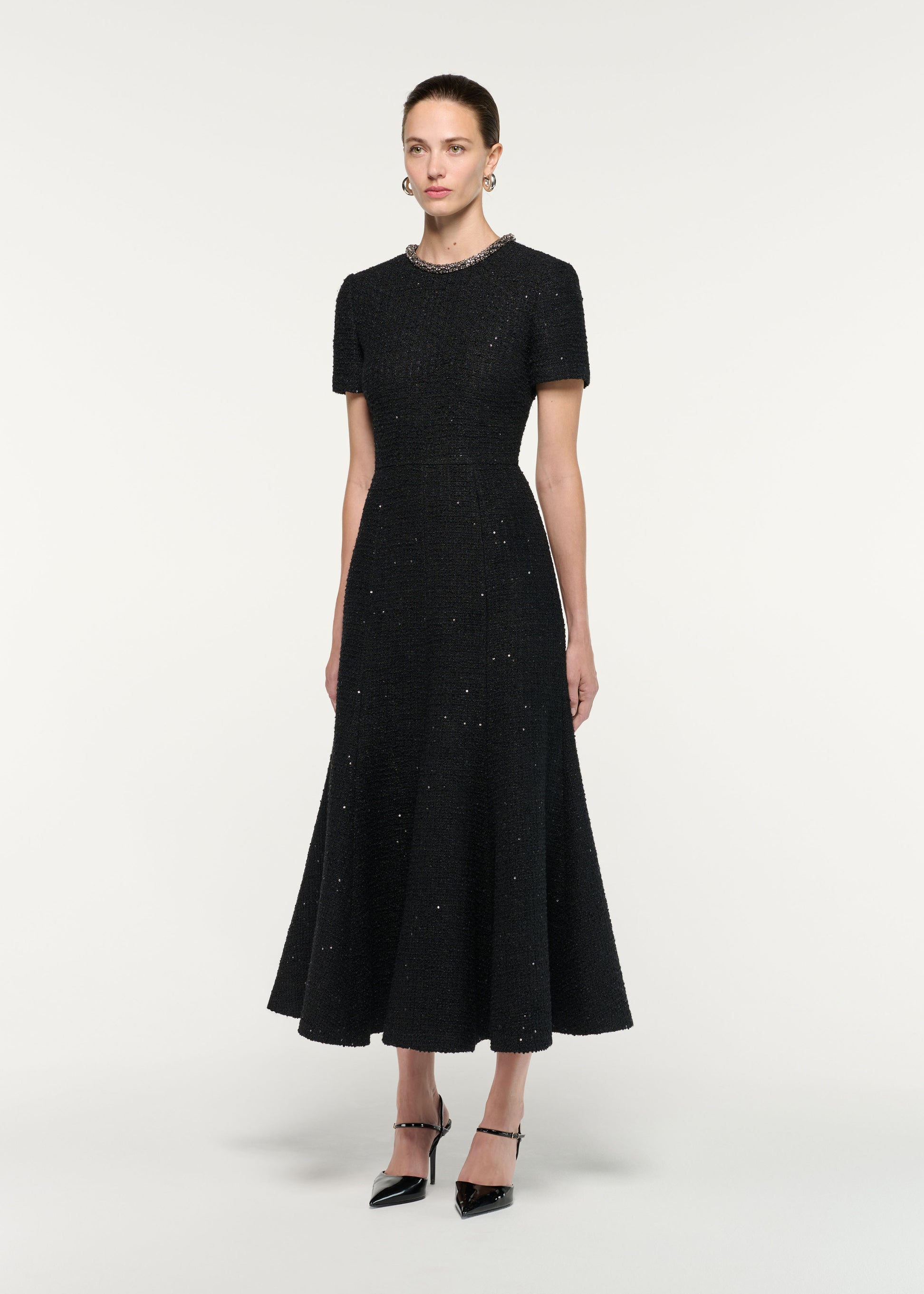 Side view of a model wearing the Embellished Neck Sequin Boucle Midi Dress