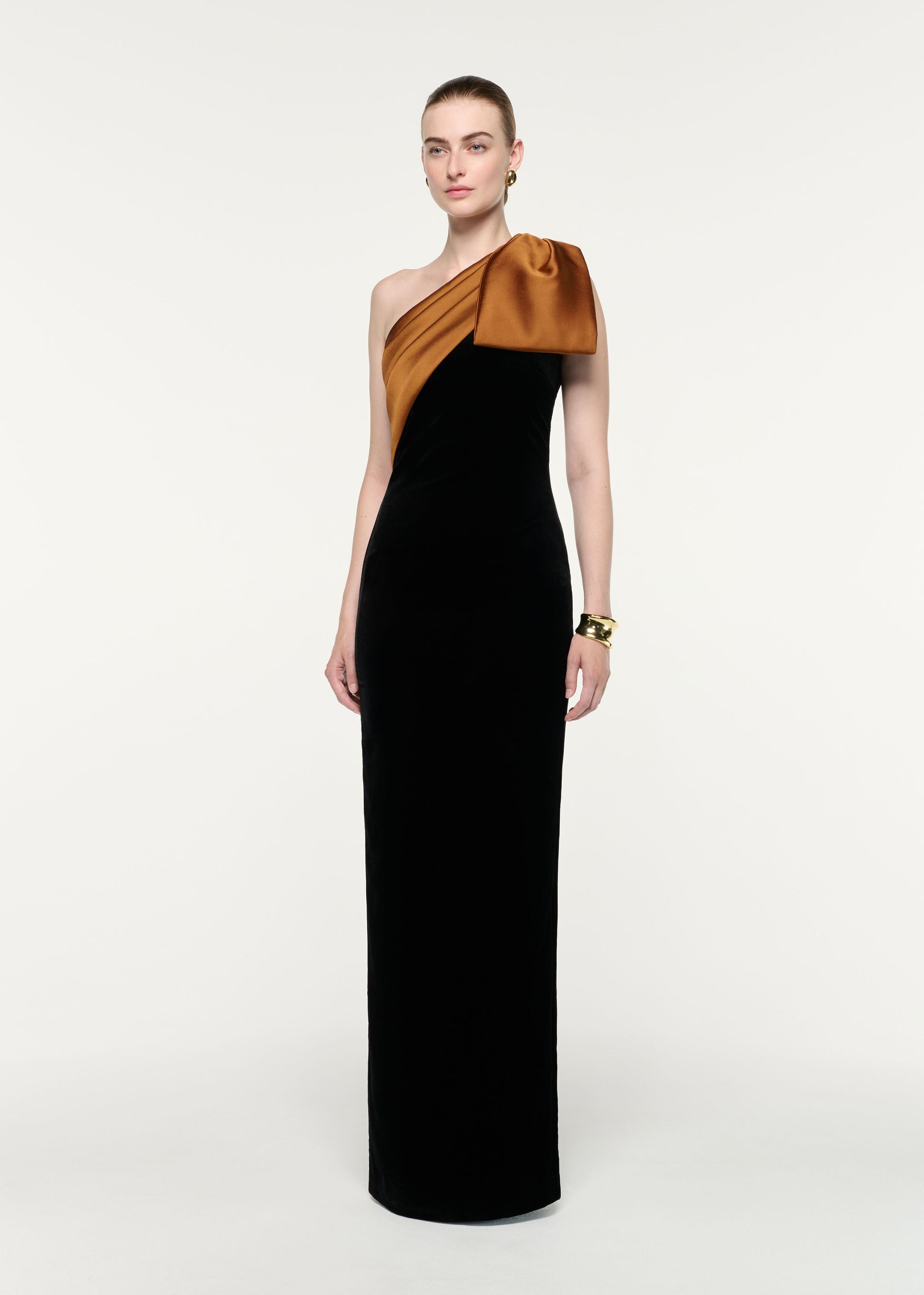 Side view of a model wearing the Satin Bow One Shoulder Velvet Gown