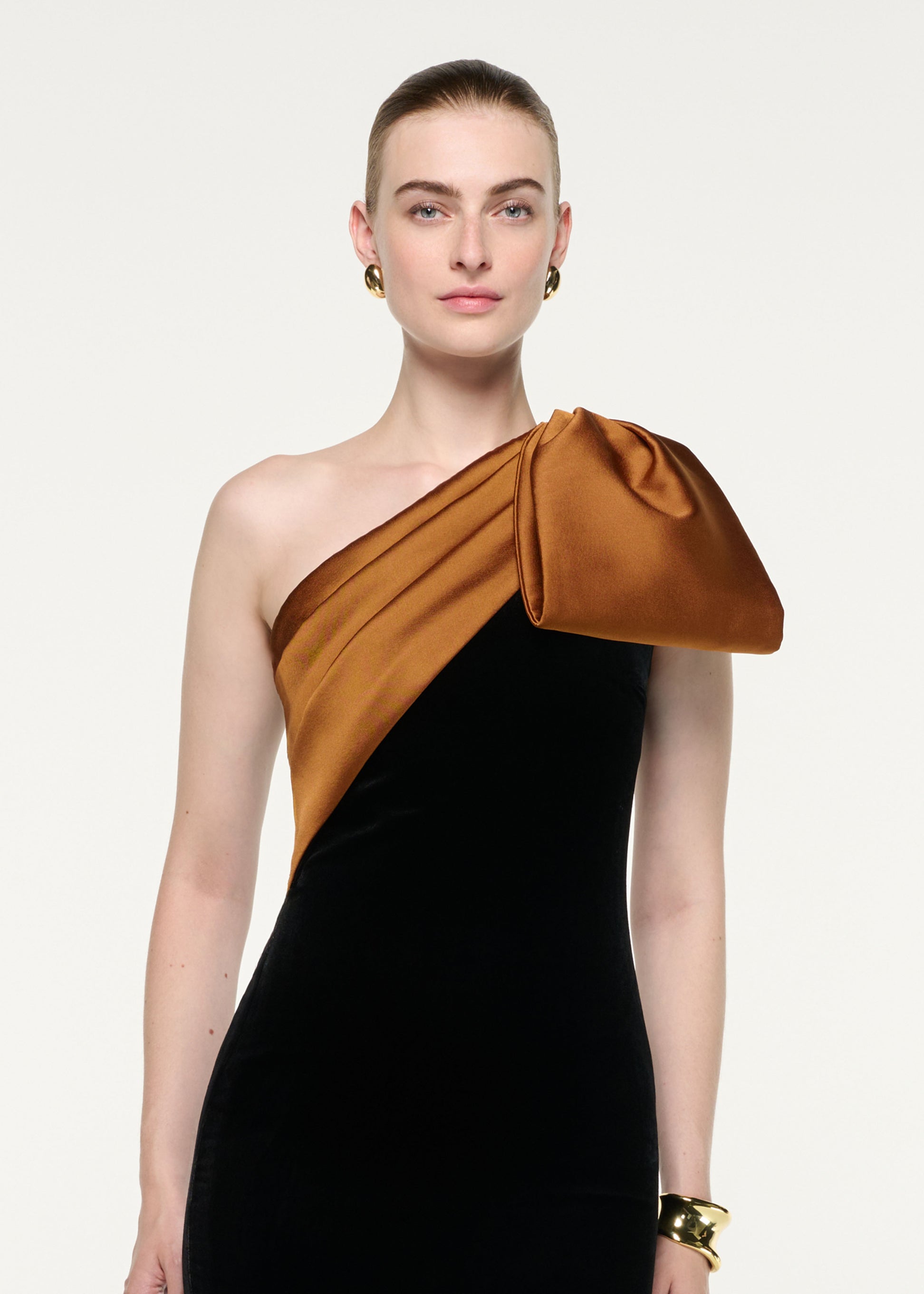 Close up of a model wearing the Satin Bow One Shoulder Velvet Gown