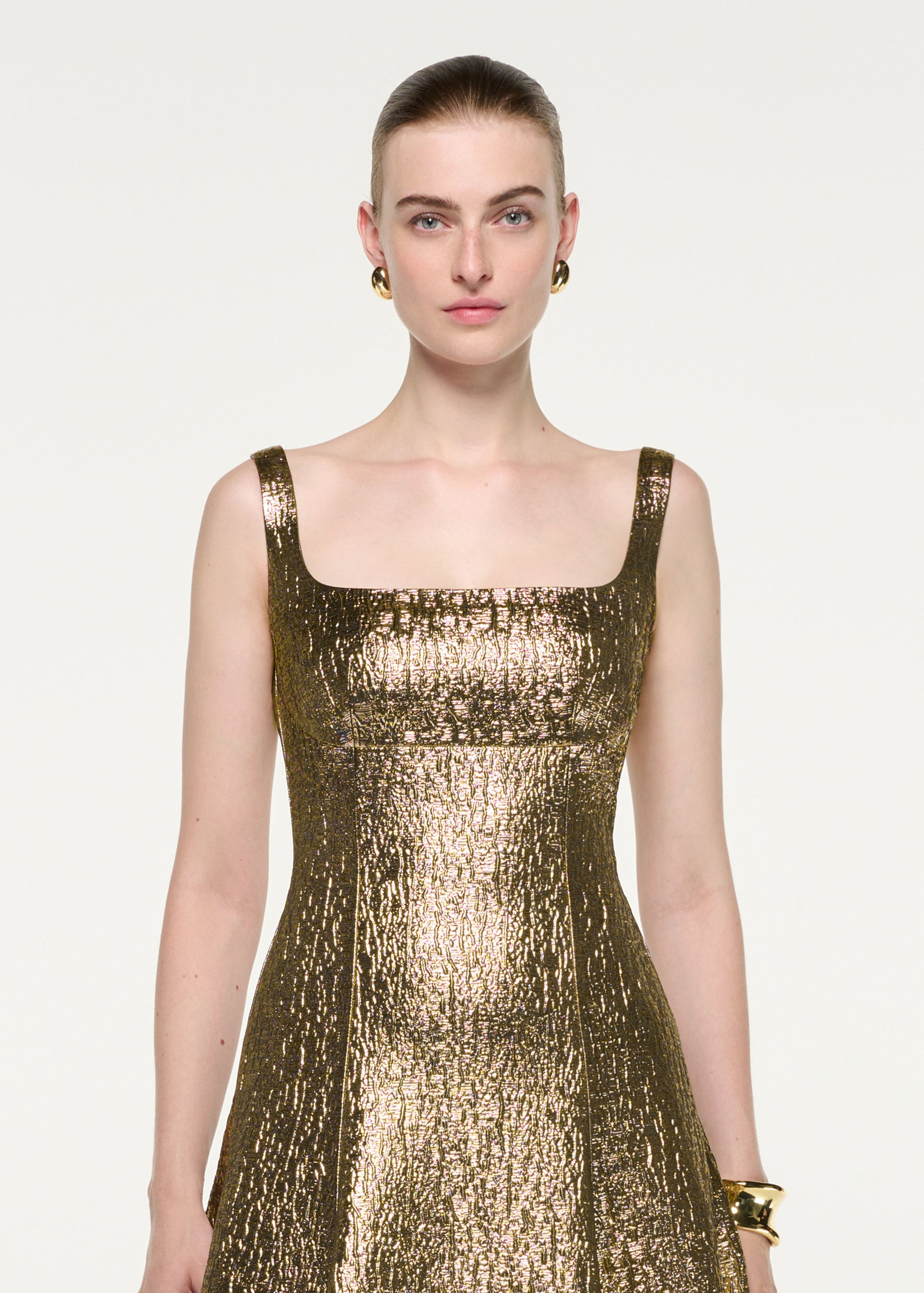 Close up of a model wearing the Metallic Jacquard Square Neck Gown