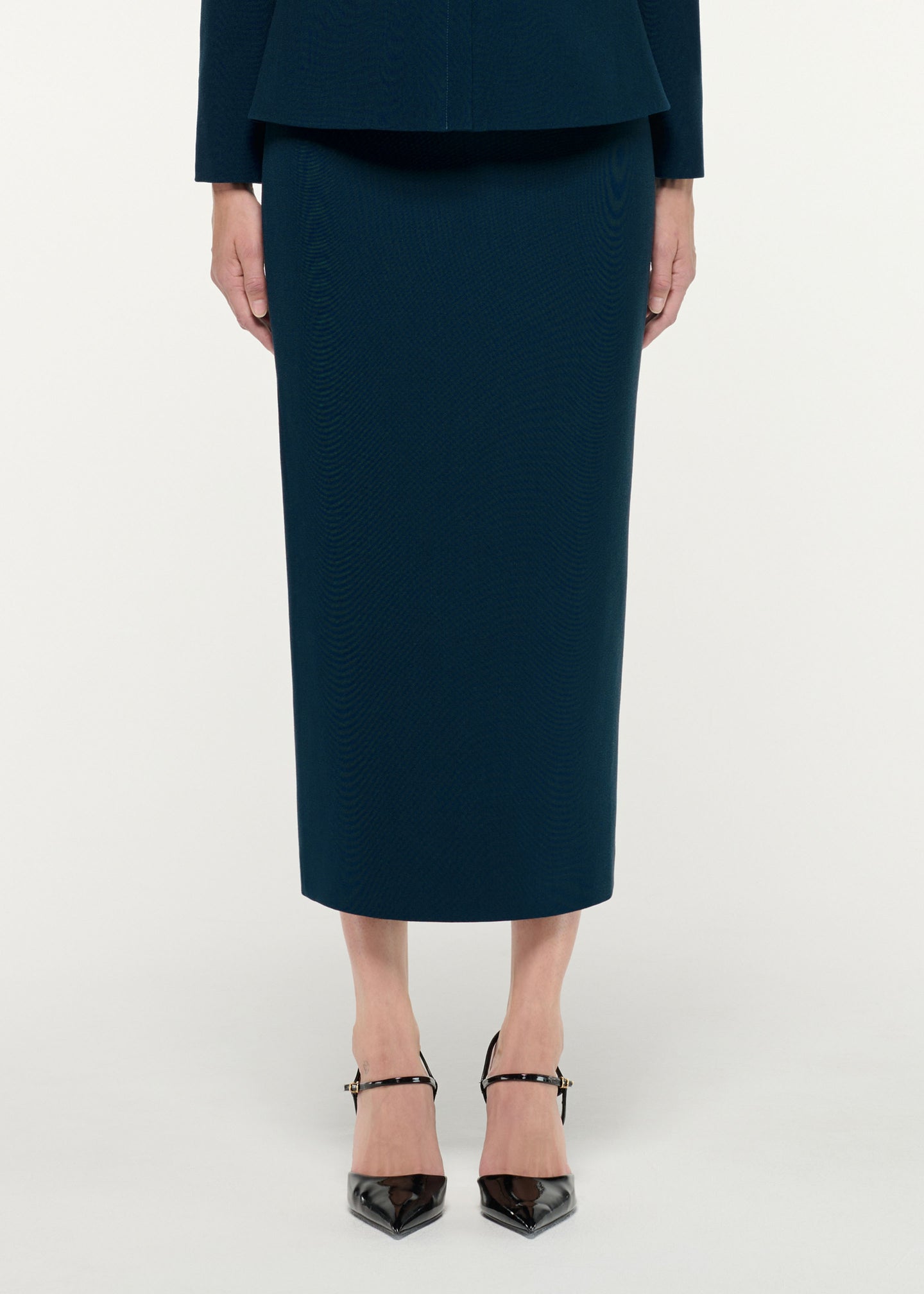 Close up of a model wearing the Crepe Midi Skirt