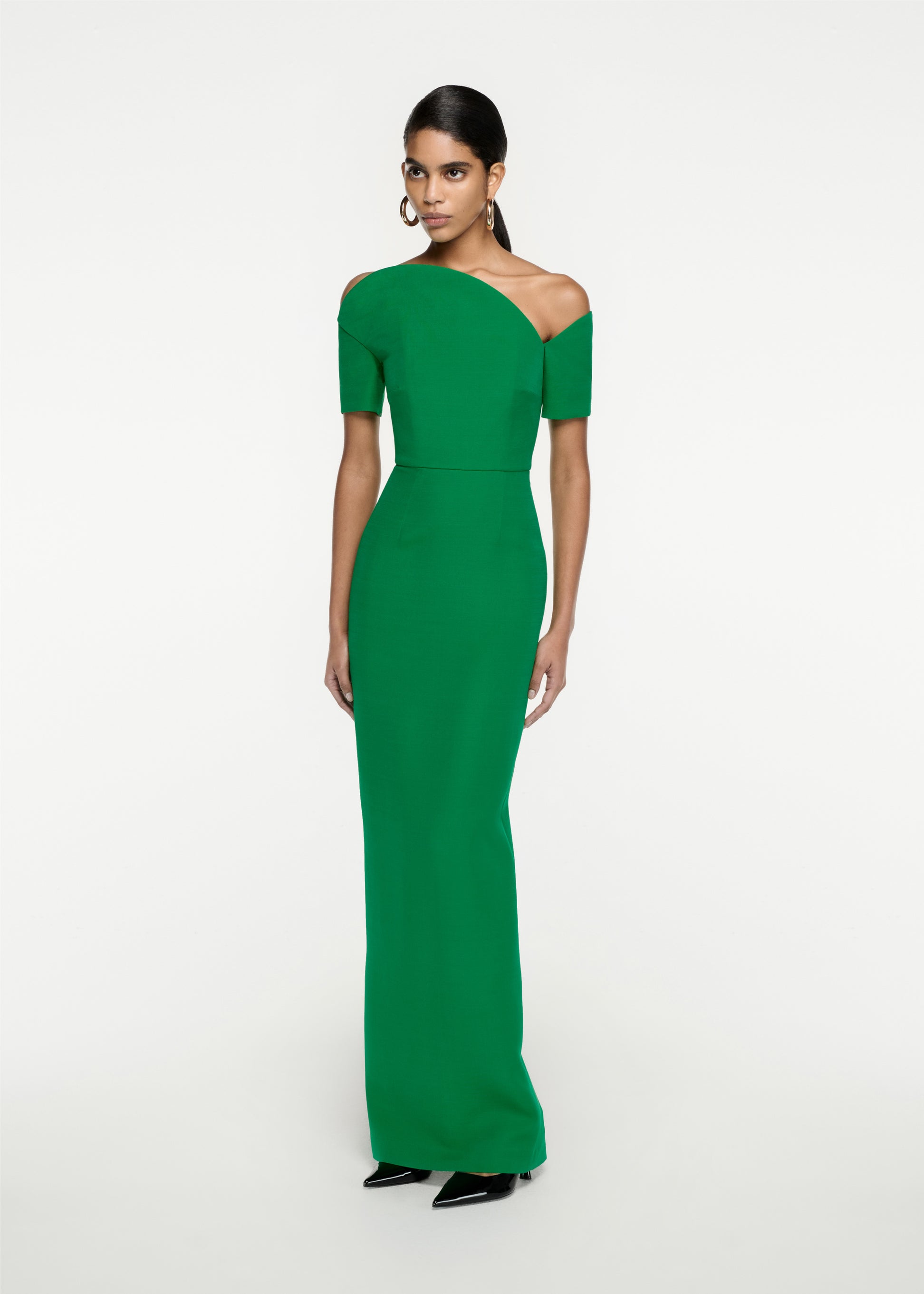 Woman wearing the Asymmetric Silk Wool Maxi Dress in Green