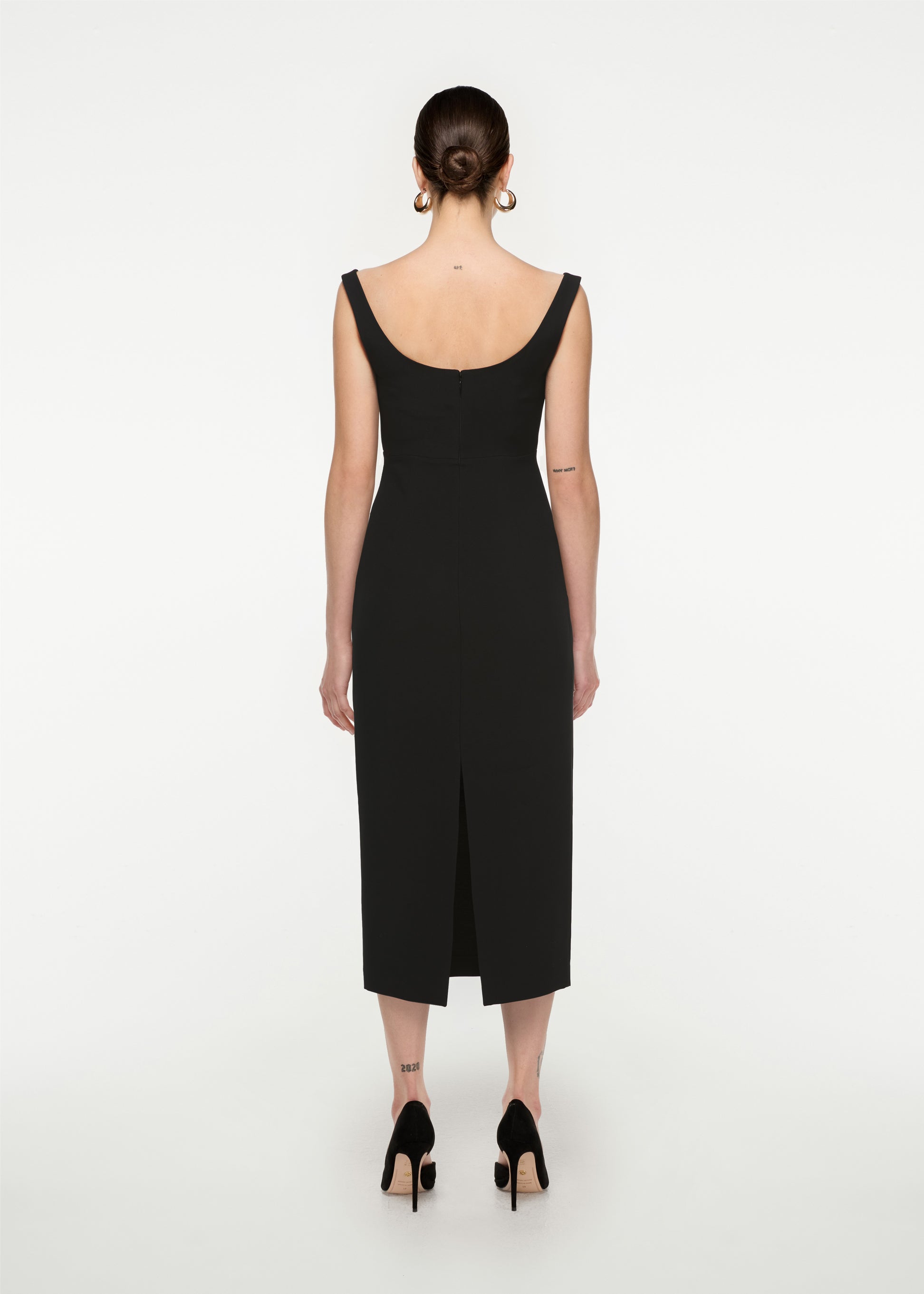The back of a woman wearing the Off Shoulder Silk Wool Diamante Midi Dress in Black